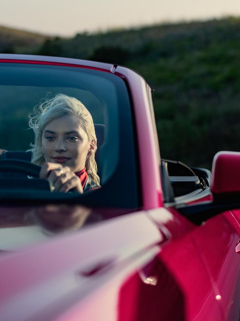 Person driving a 2025 Ford Mustang® GT convertible on a highway