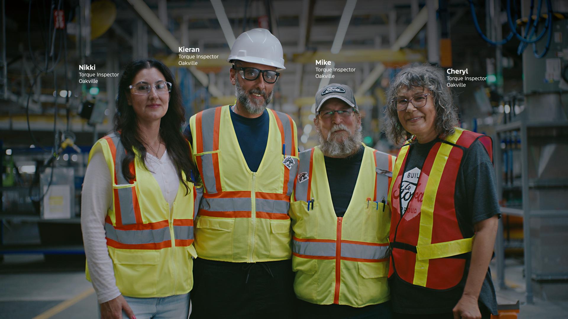 Group shot of Ford employees on the factory floor. Text reads: Nikki, Torque Inspector, Oakville. Kieran, Torque Inspector, Oakville. Mike, Torque Inspector, Oakville. Cheryl, Torque Inspector, Oakville. 