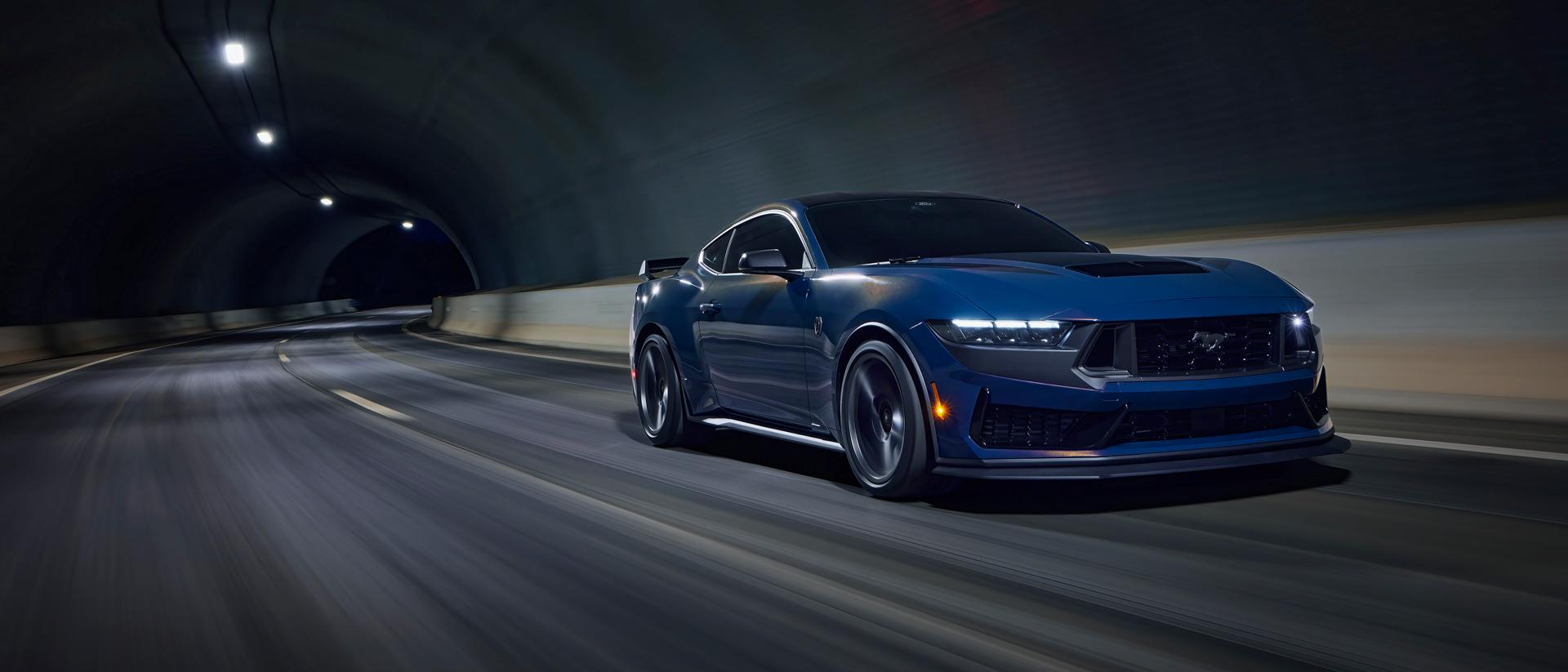 2026 Ford Mustang Dark Horse® fastback being driven in a tunnel