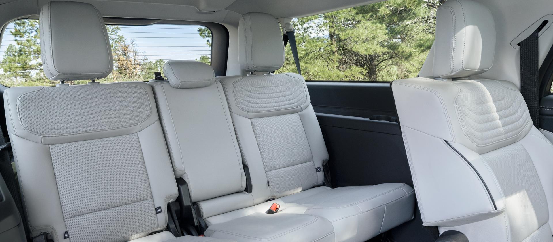 2026 Ford Expedition® Platinum™ SUV rear seating area with a seat folded flat