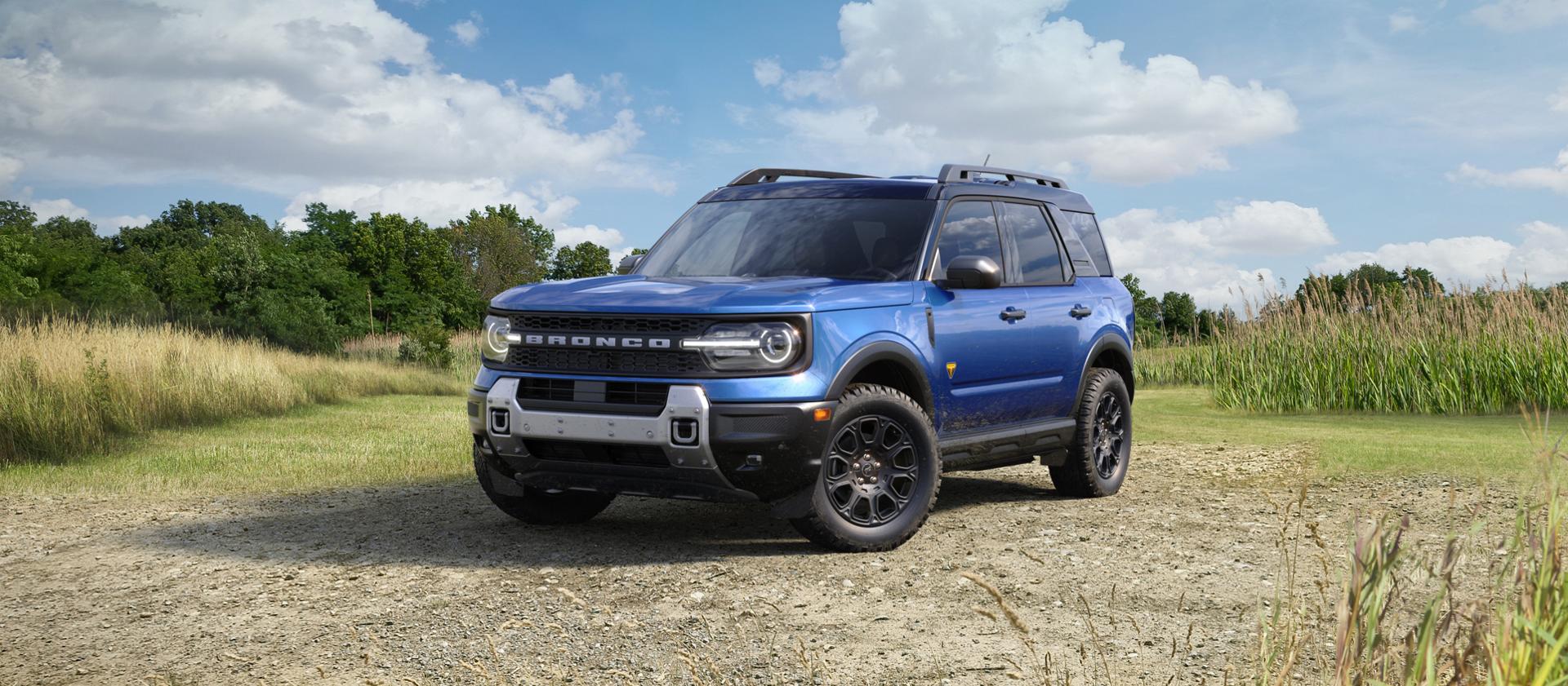 2026 Ford Bronco Sport® SUV parked on a gravel area with trees in the background