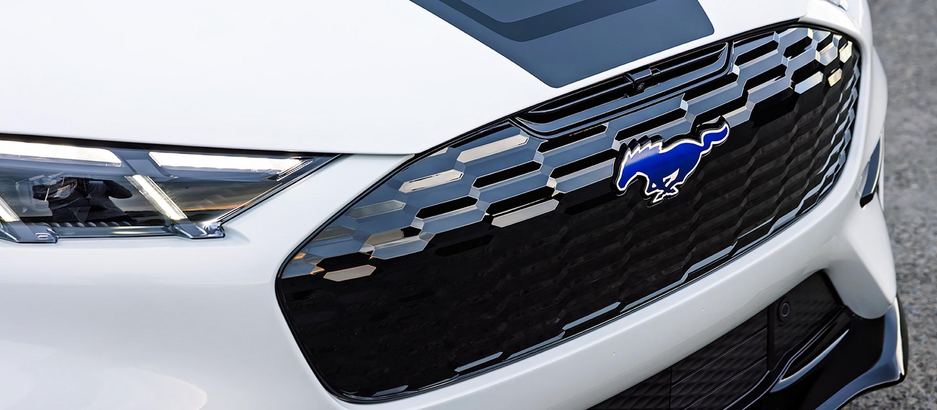 Rave-Blue Pony badge and hood stripe of the California Special Package on the U.S. 2026 Ford Mustang Mach-E® SUV