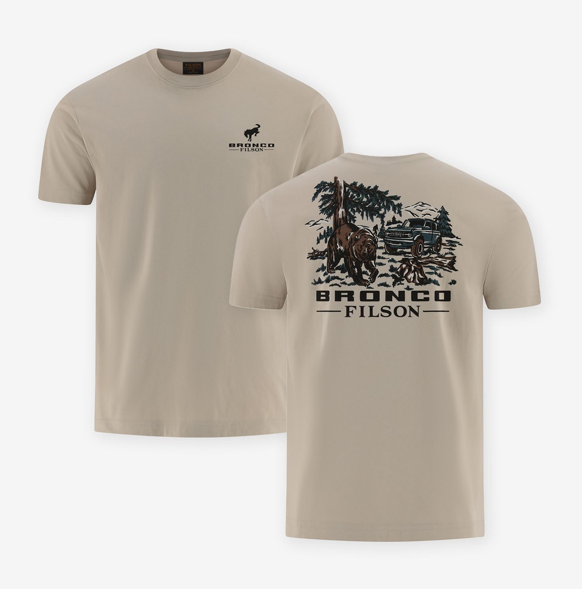The front and reverse of a cream t-shirt illustrated with a forest scene showing a bear, an SUV, and the Bronco® Filson logo