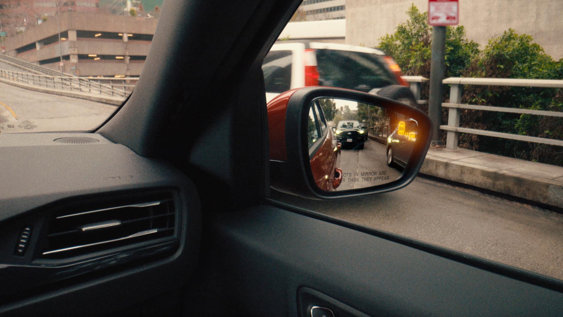 Close-up of sideview mirror showing Blind Spot Information System on the 2026 Ford Escape® SUV
