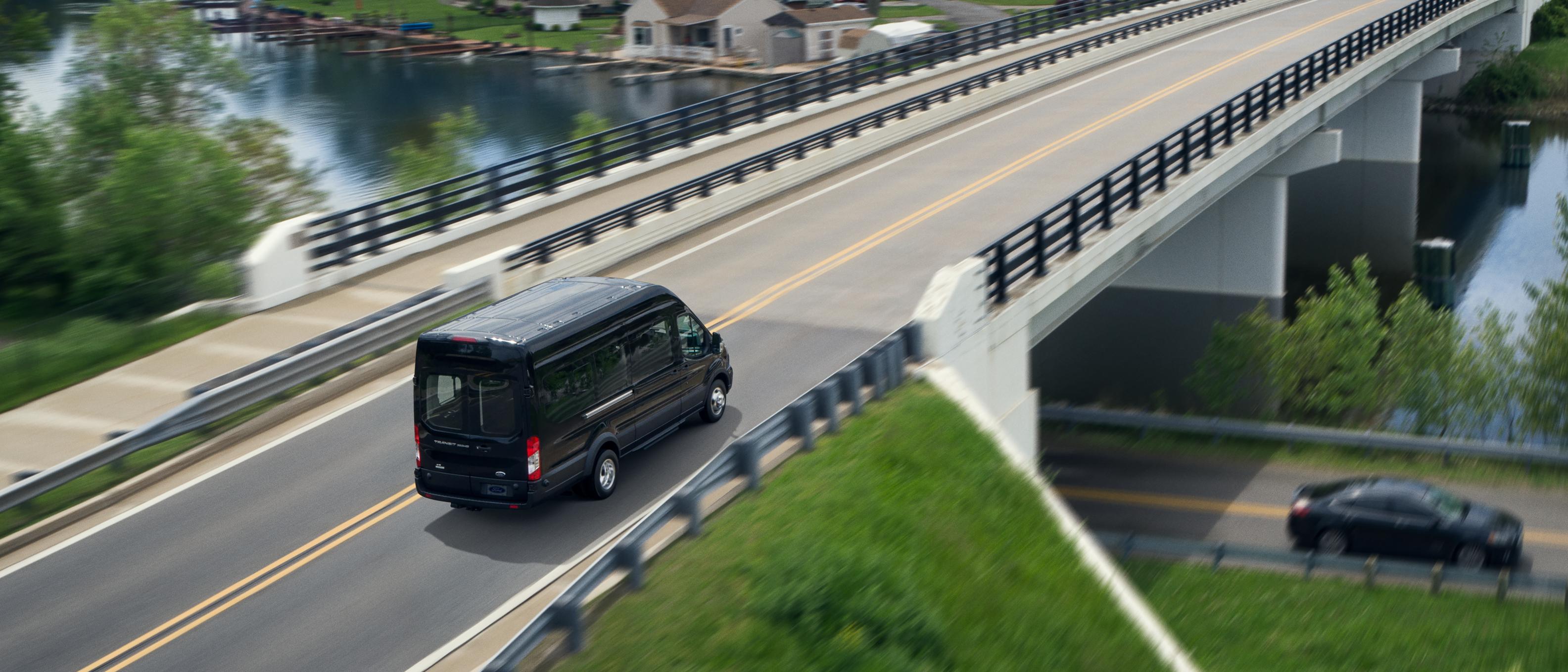 Overhead shot of a 2025 Ford Transit® Van being driven over a highway overpass