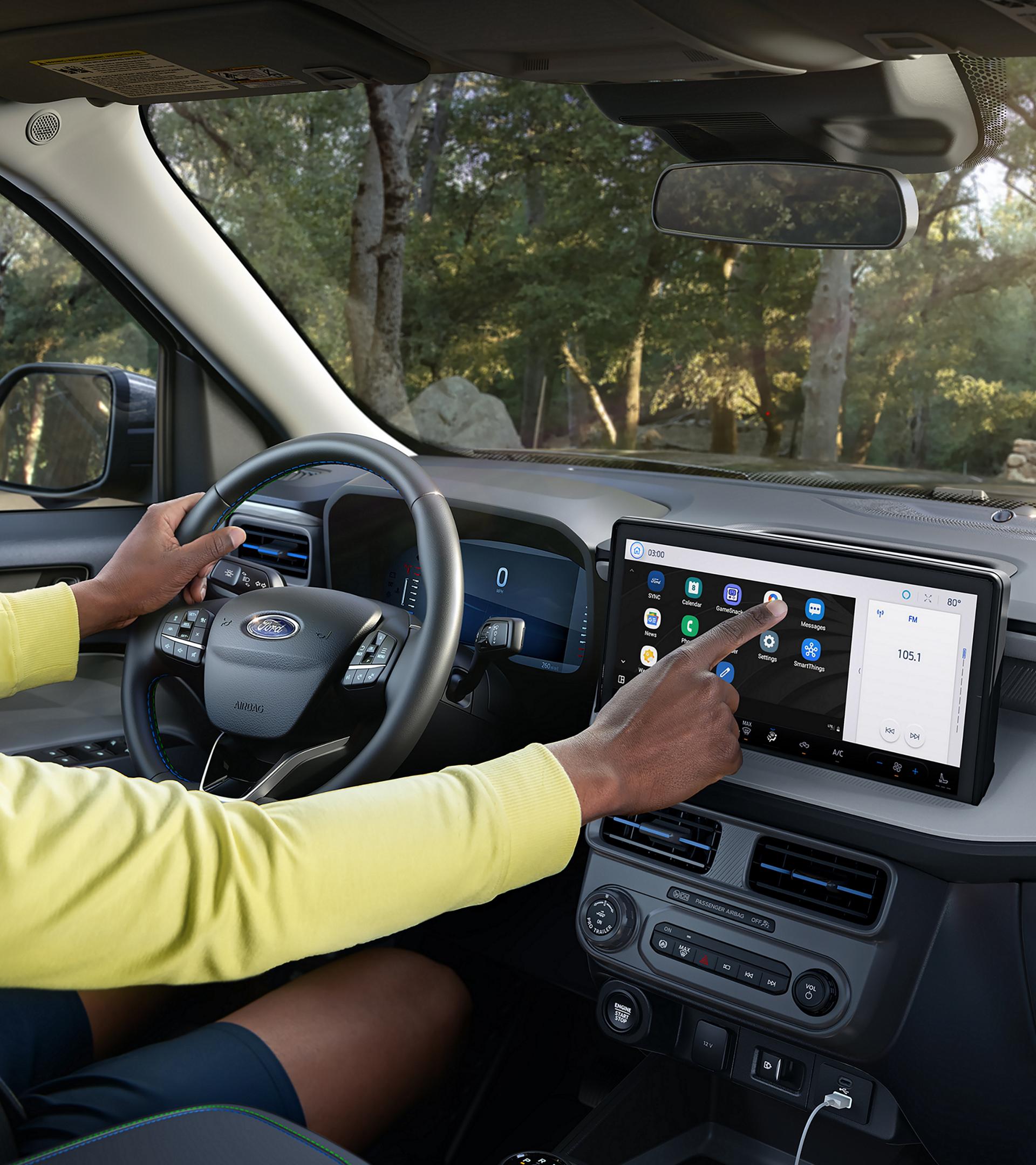 A Person using the 13.2" centre display