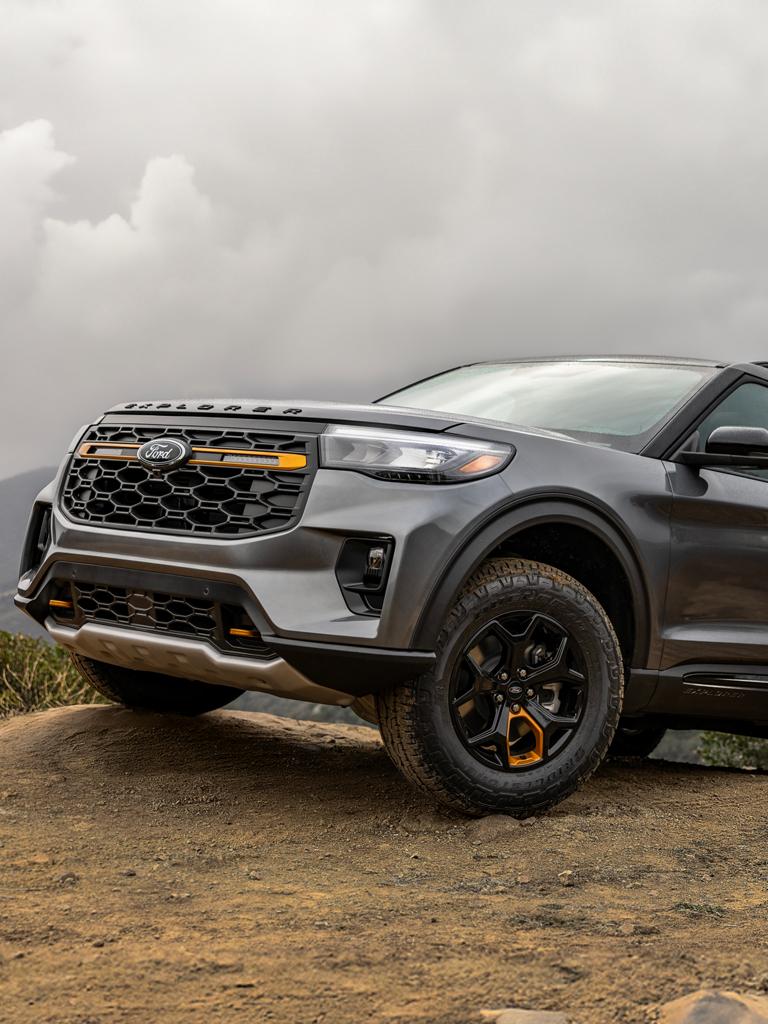 A 2026 Ford Explorer® Tremor® model parked on a grassy hillside
