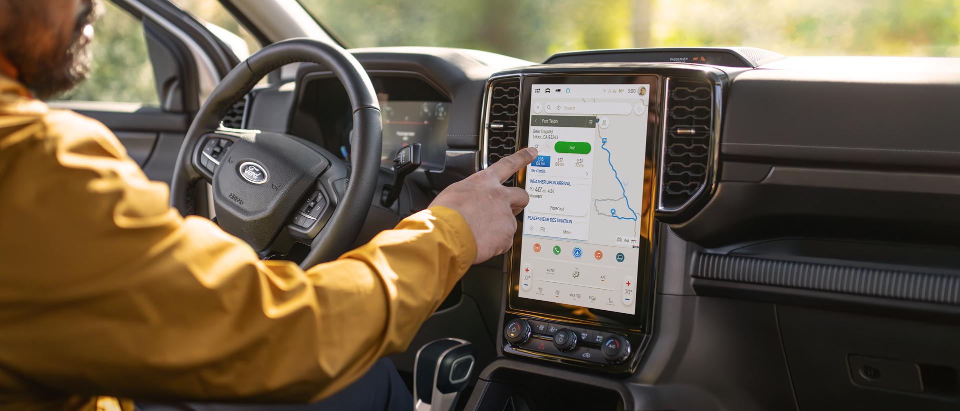 Person using 12" touch screen in the 2025 Ford Ranger®
