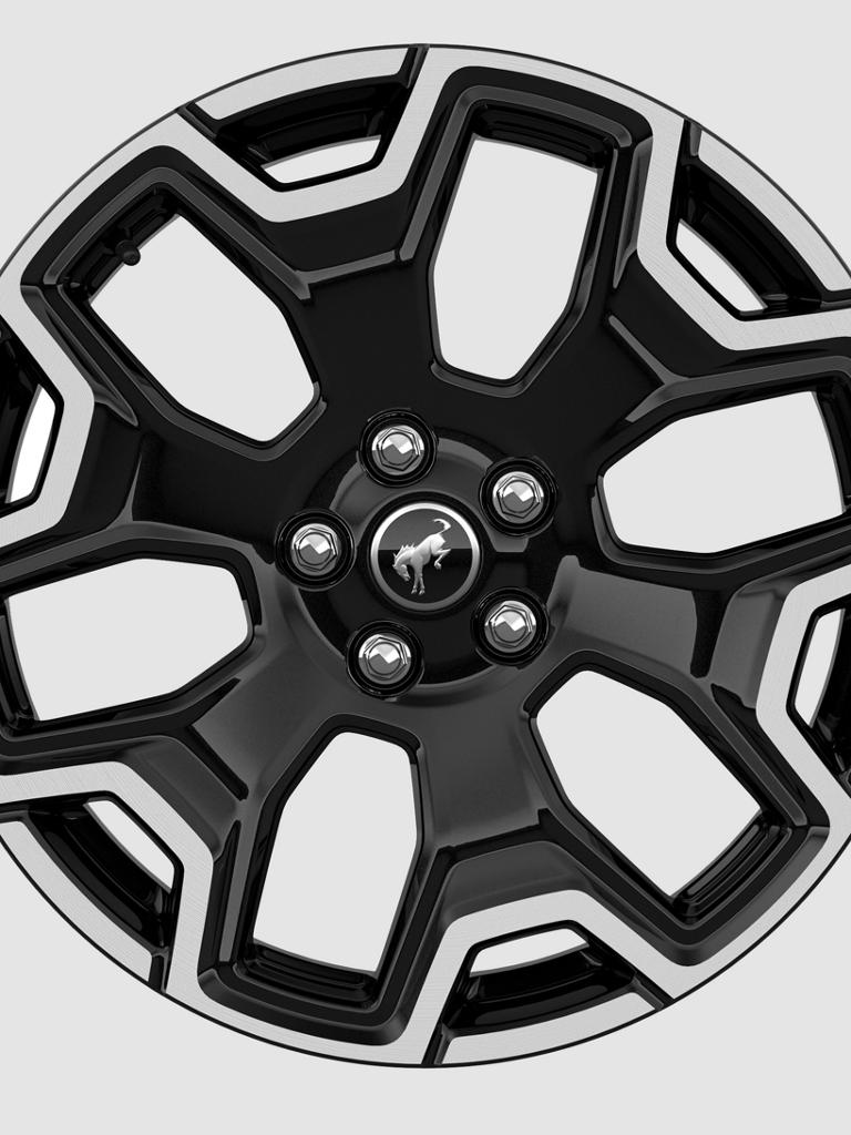 18" machine-faced aluminum wheels shown on a white background
