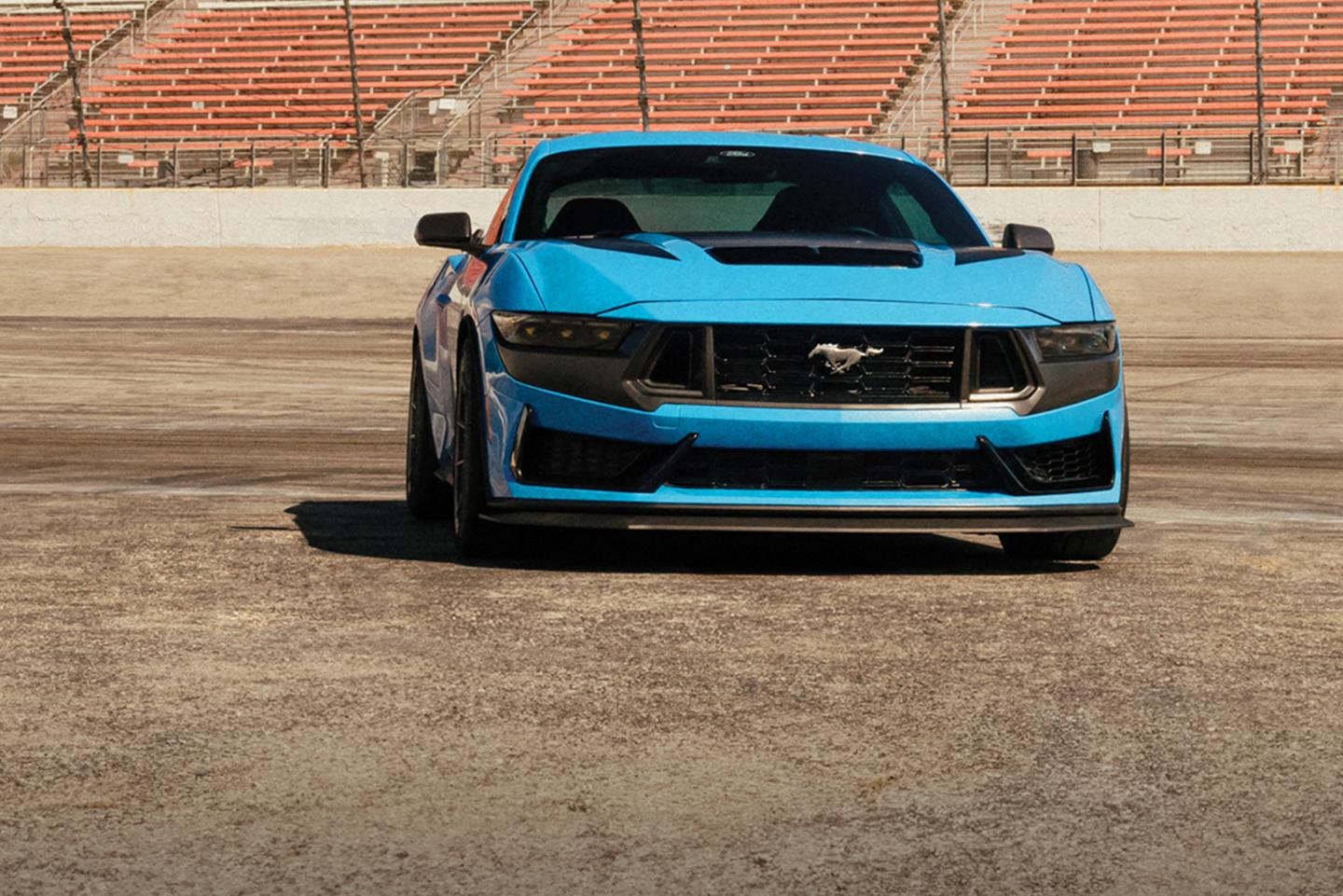 Mustang Dark Horse on a track.