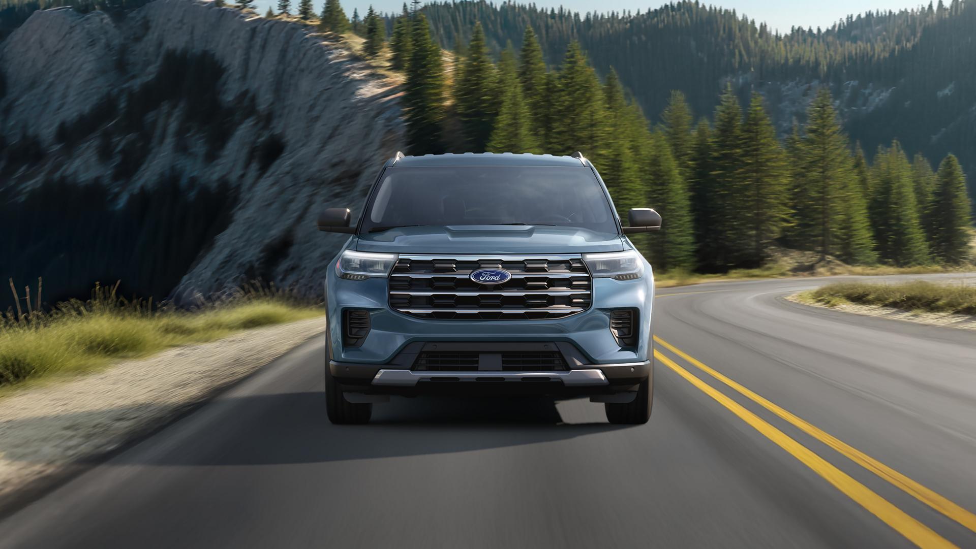 The front of a 2026 Ford Explorer® SUV parked in a field