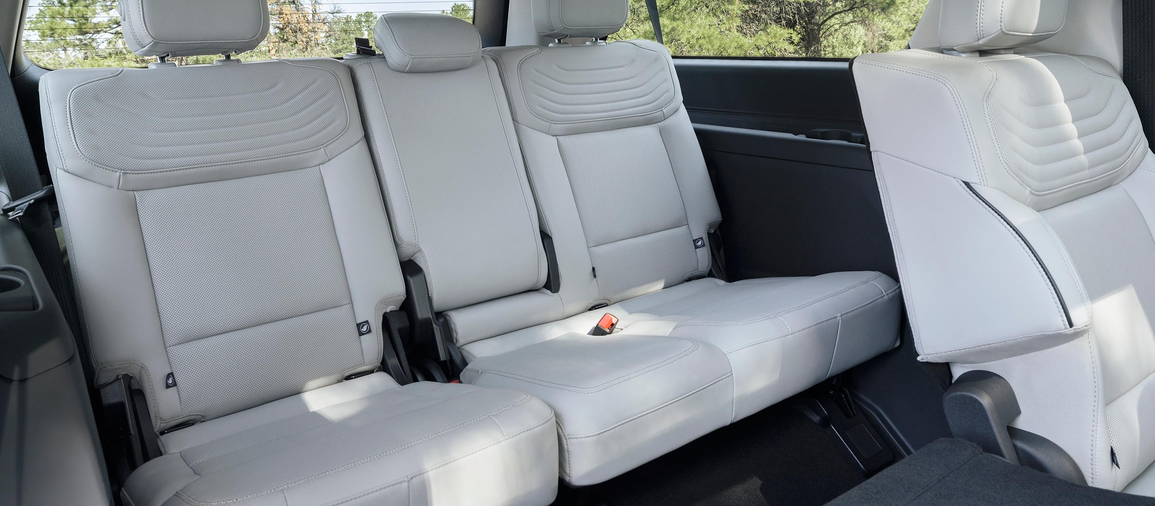 2027 Ford Expedition® Platinum™ SUV rear seating area with a seat folded flat