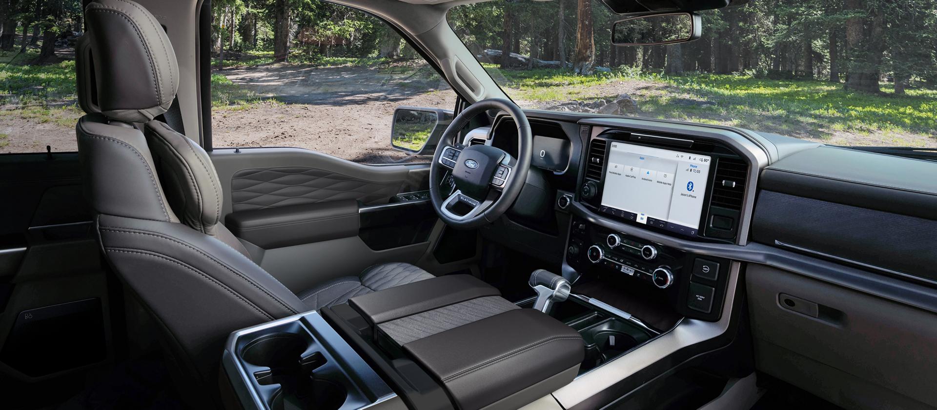 Interior of a 2026 Ford F-150® Platinum® model parked in a wooded setting