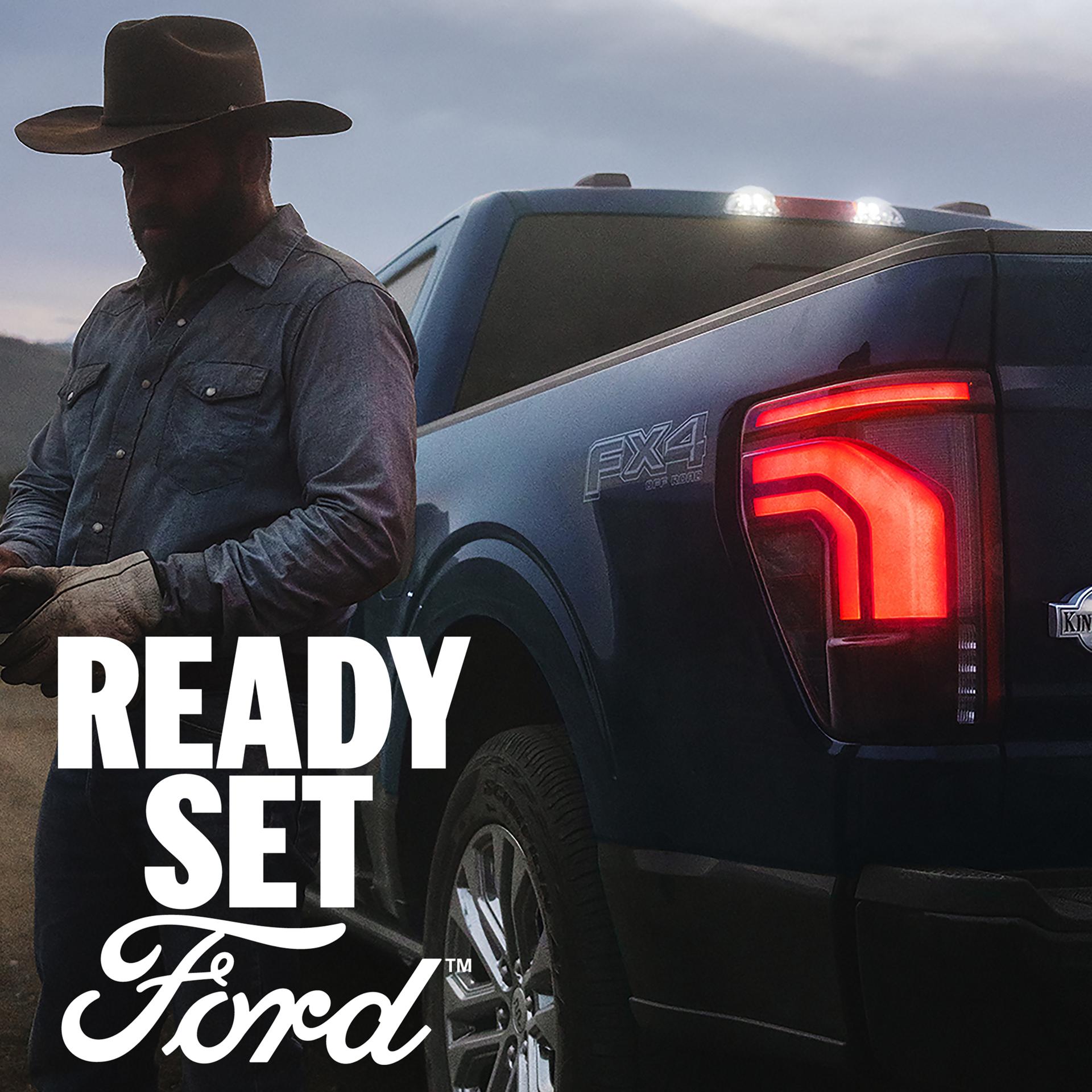 Close-up of a man standing next to a 2026 F-150® King Ranch® model