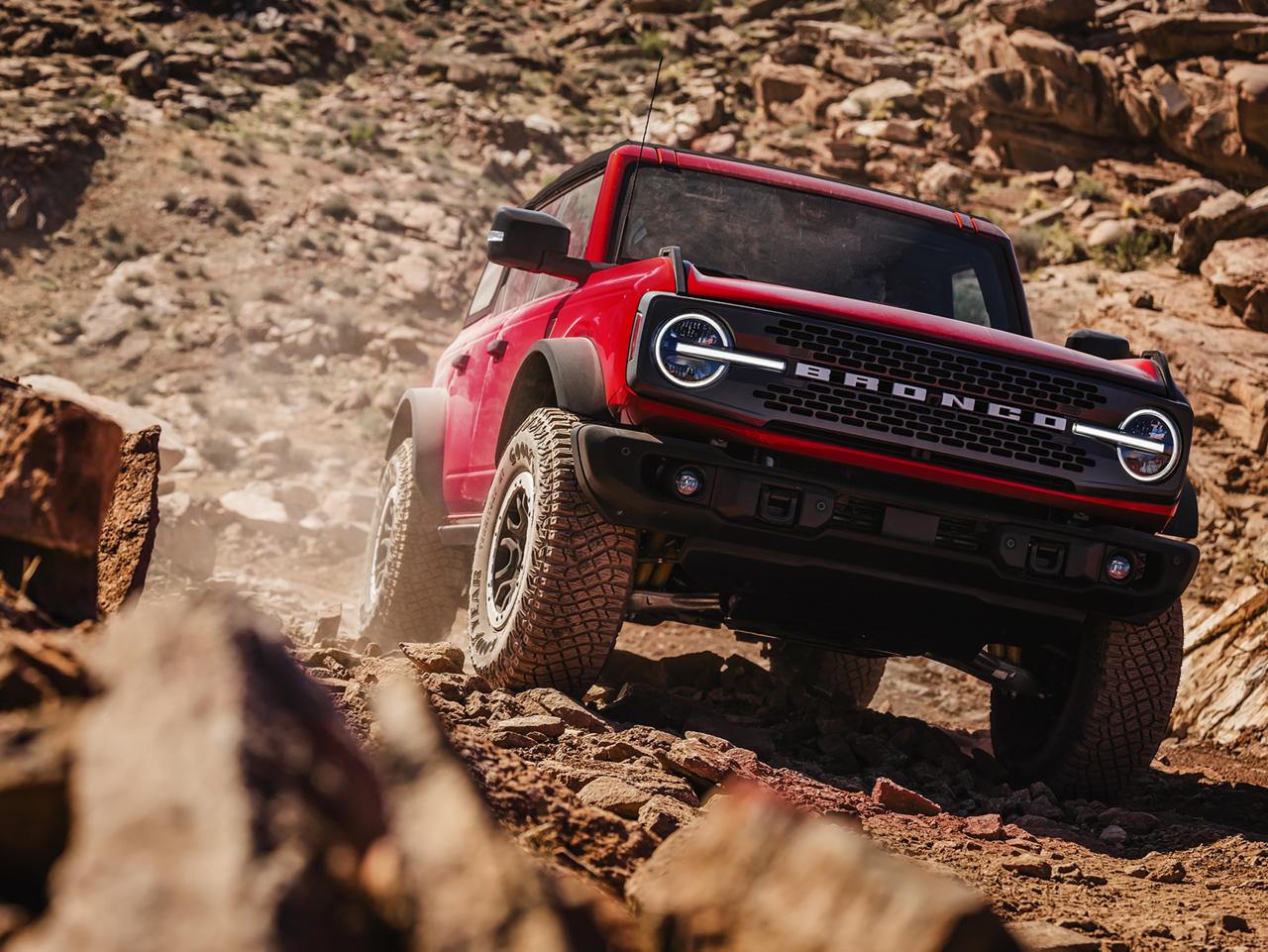A 2026 Ford Bronco® SUV descending a muddy hill