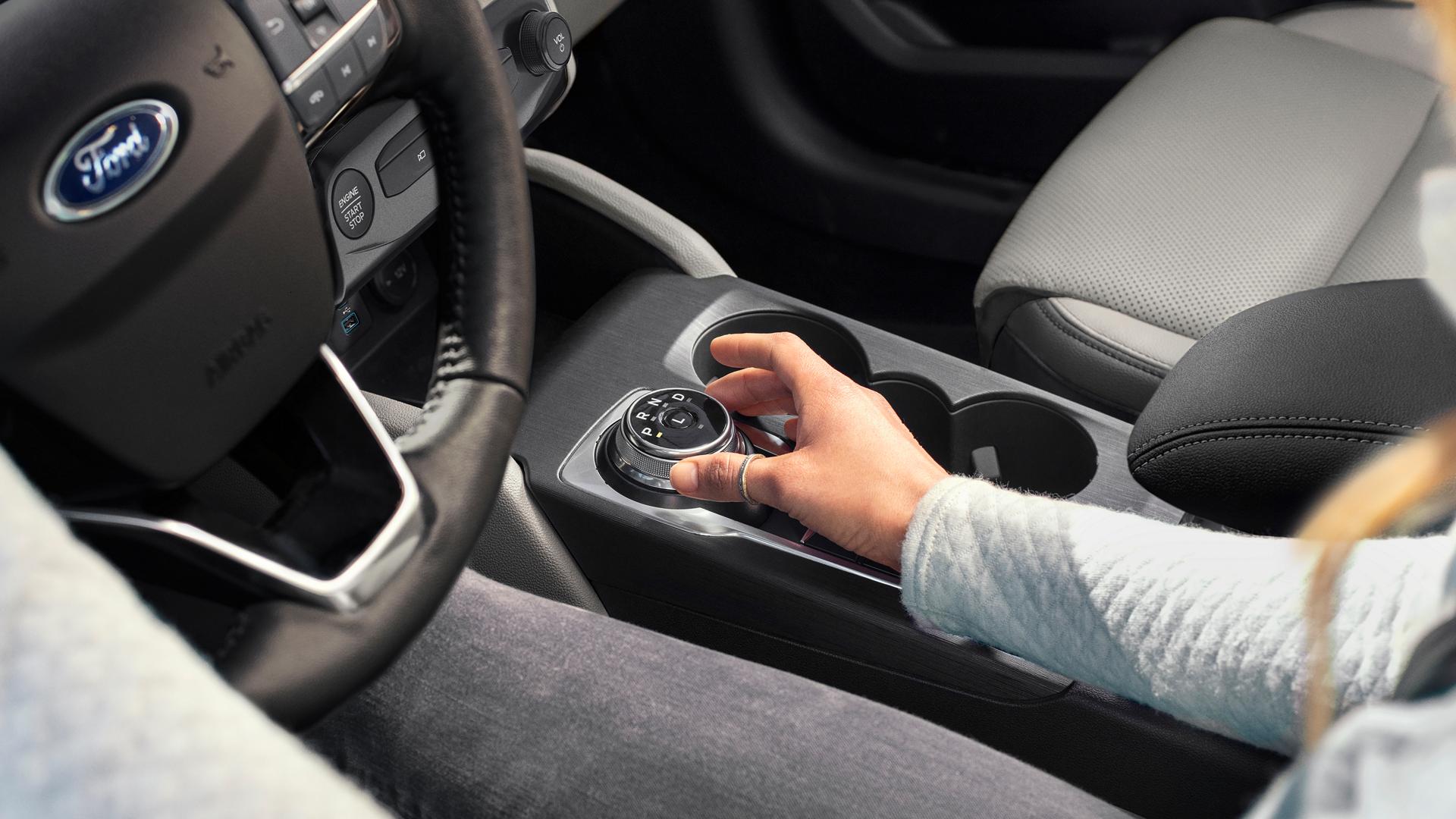 Person adjusting the rotary gear shift dial in a 2026 Ford Escape® SUV