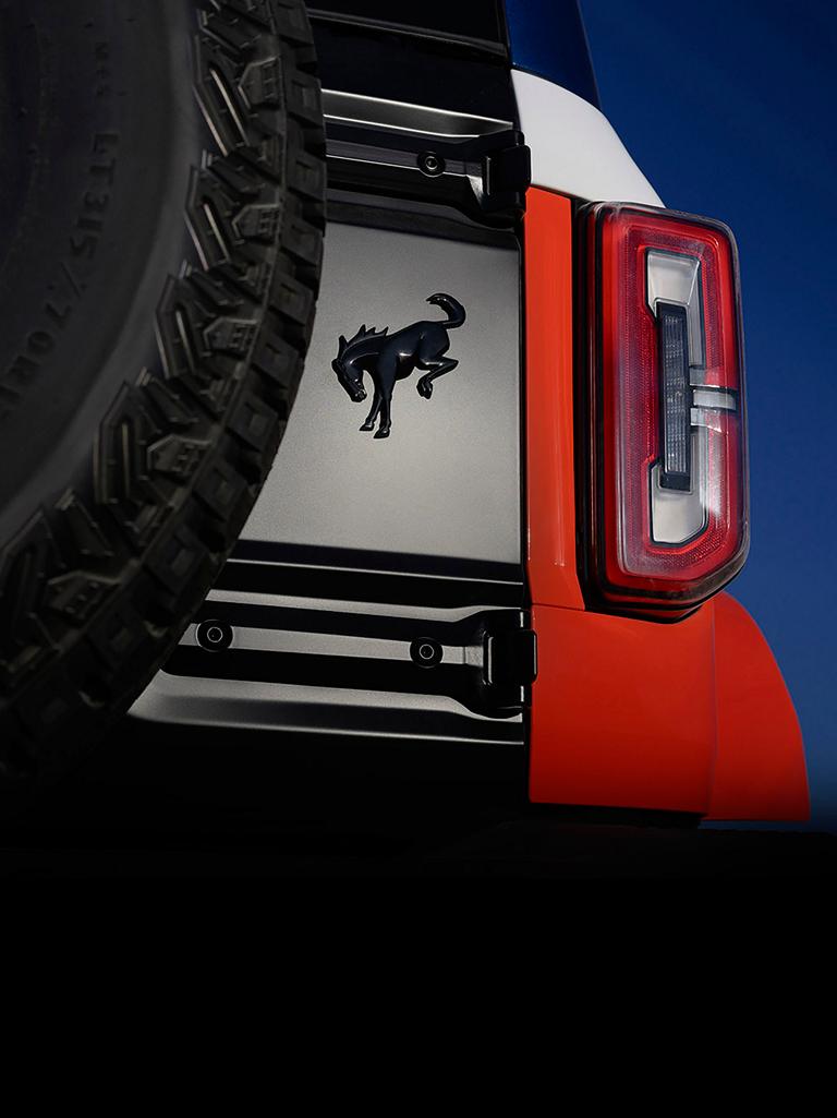 A close-up of the Bronco badge on the rear swing gate of a 2026 Ford Bronco® Stroppe Edition SUV