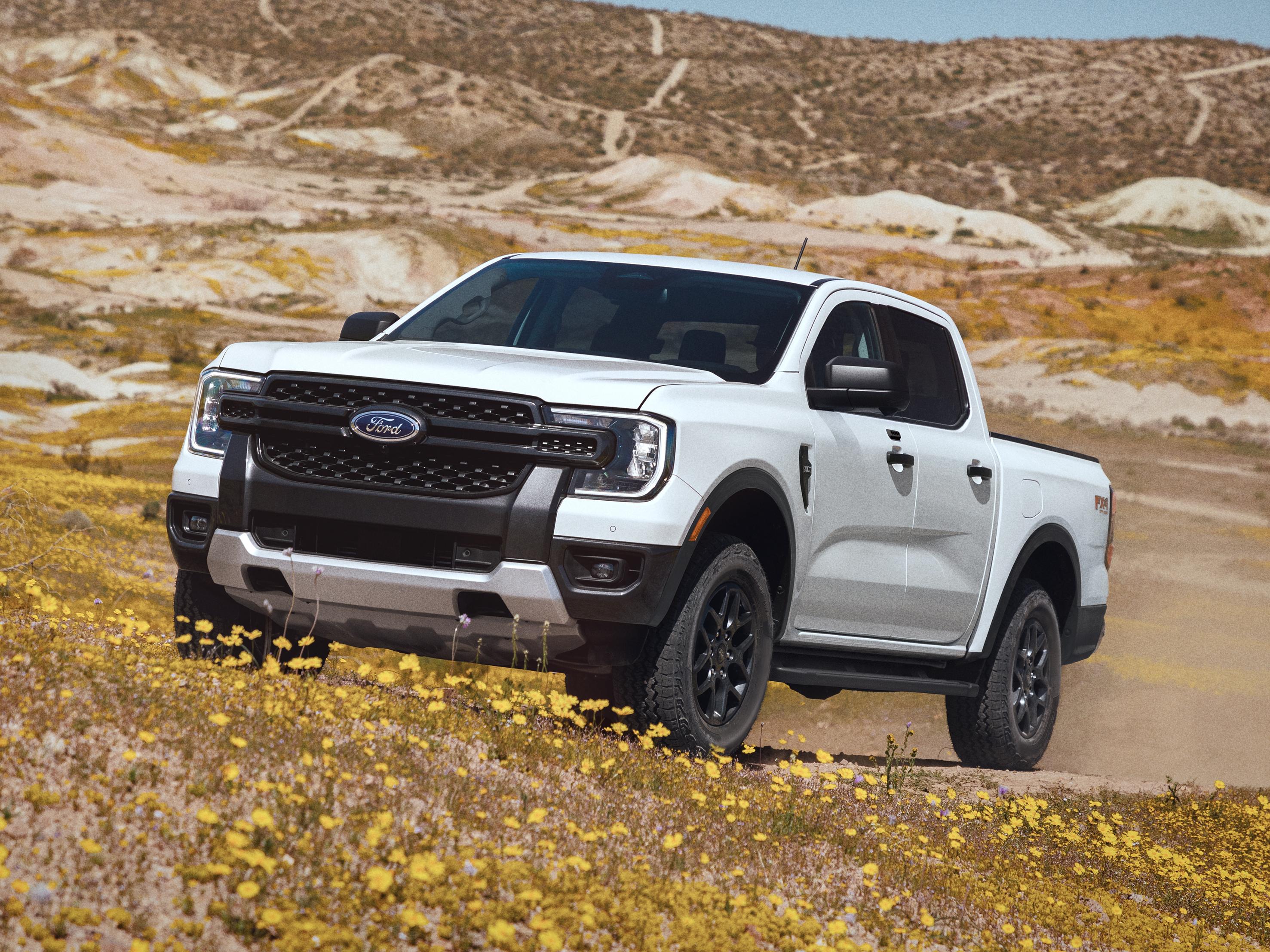 2026 Ford Ranger® XLT truck being driven on an uneven, grassy terrain