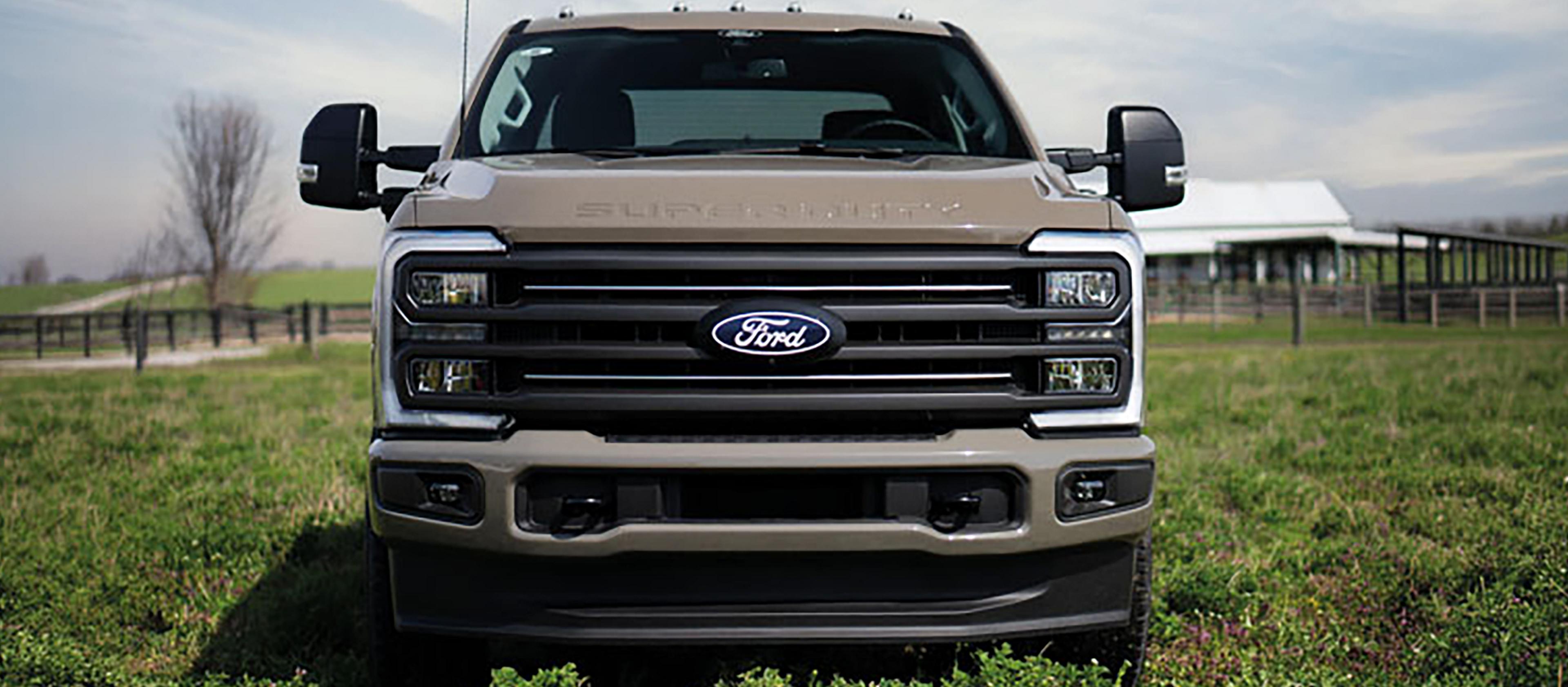 2027 Super Duty® F-250® XLT model with the Super Duty Carhartt® Package parked in a grassy field