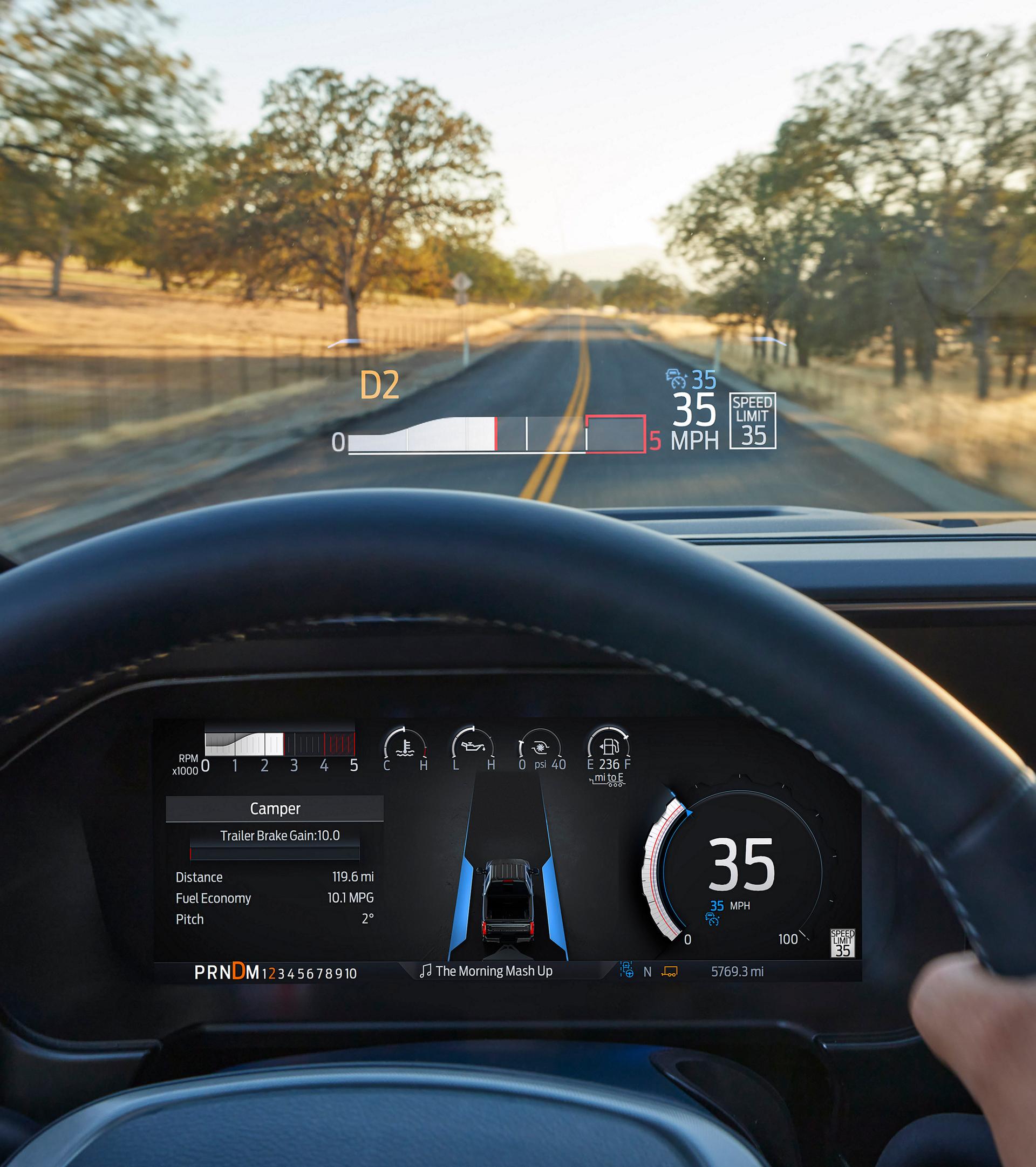The driver's POV of the dashboard and windshield while using the head-up display feature