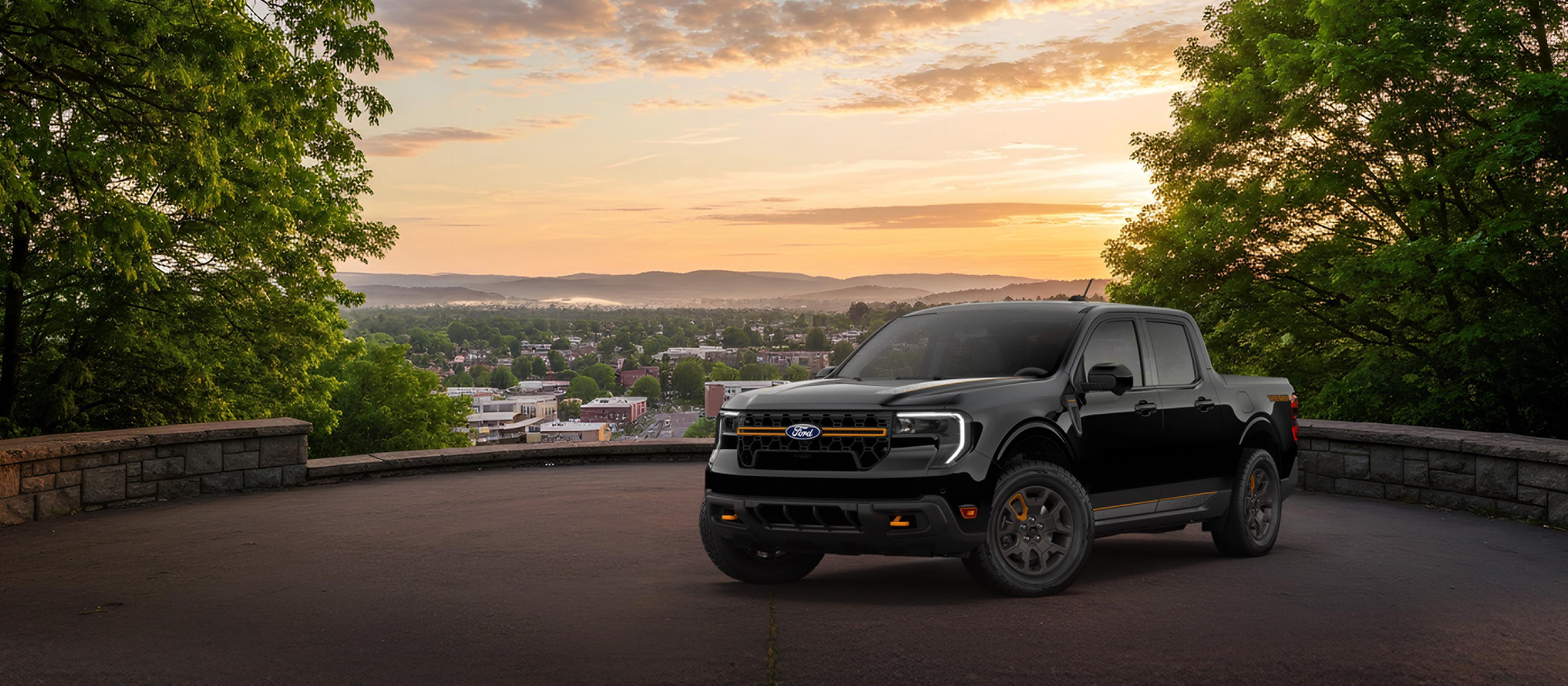 2026 Ford Maverick® Tremor® model in Shadow Black parked overlooking a city