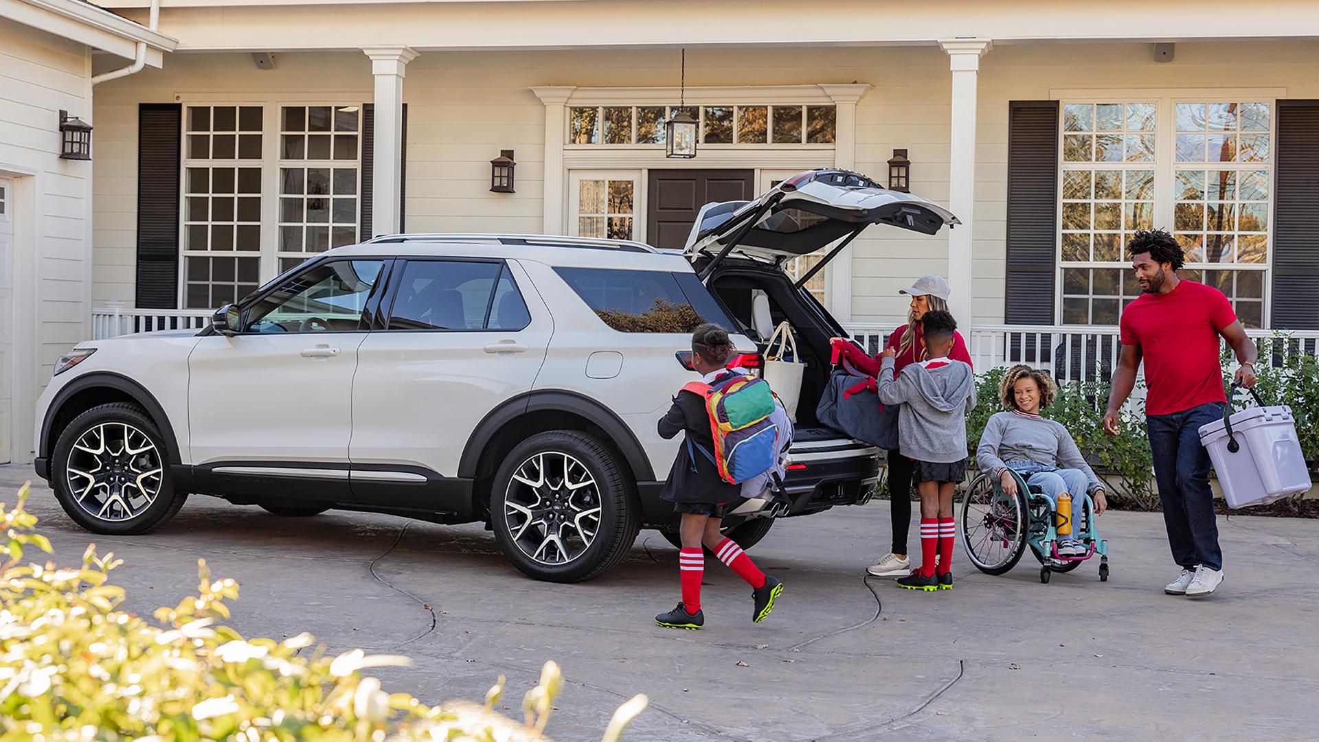 The rear of a 2027 Ford Explorer® SUV with the power liftgate open