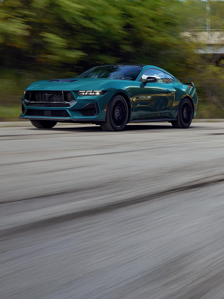 A 2026 Ford Mustang® GT Fastback being driven on a highway