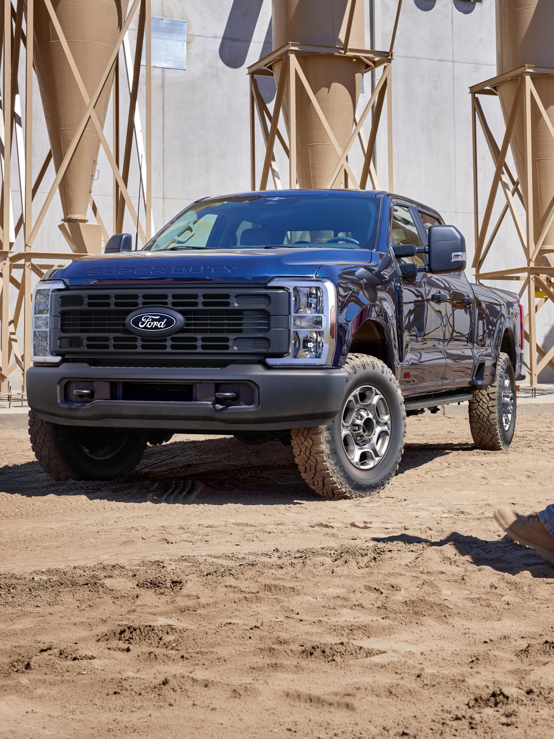 2027 Ford Super Duty® F-250® XL model with the STX® Appearance Package and Tremor® Off-Road Package parked on a construction site