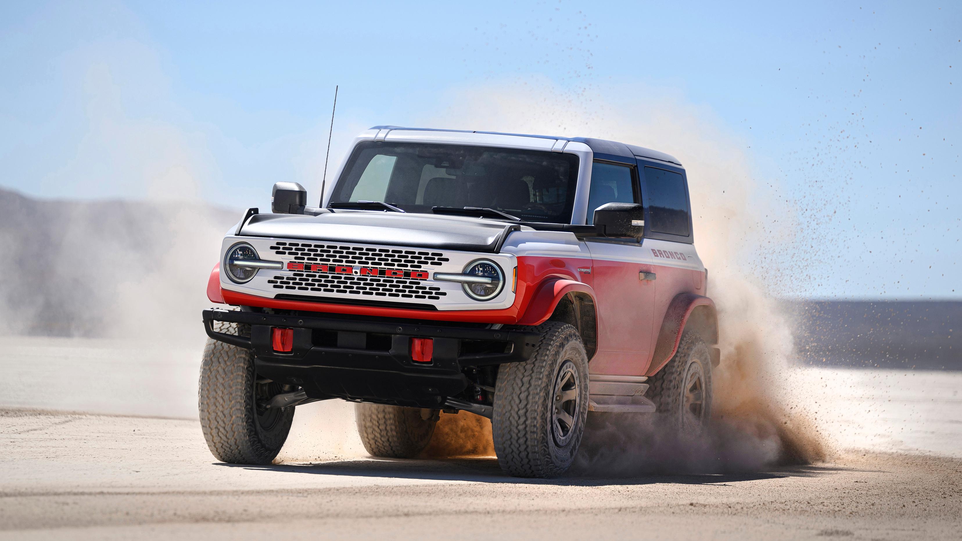 A 2025 Ford Bronco® Stroppe Edition SUV kicking up sand on a beach