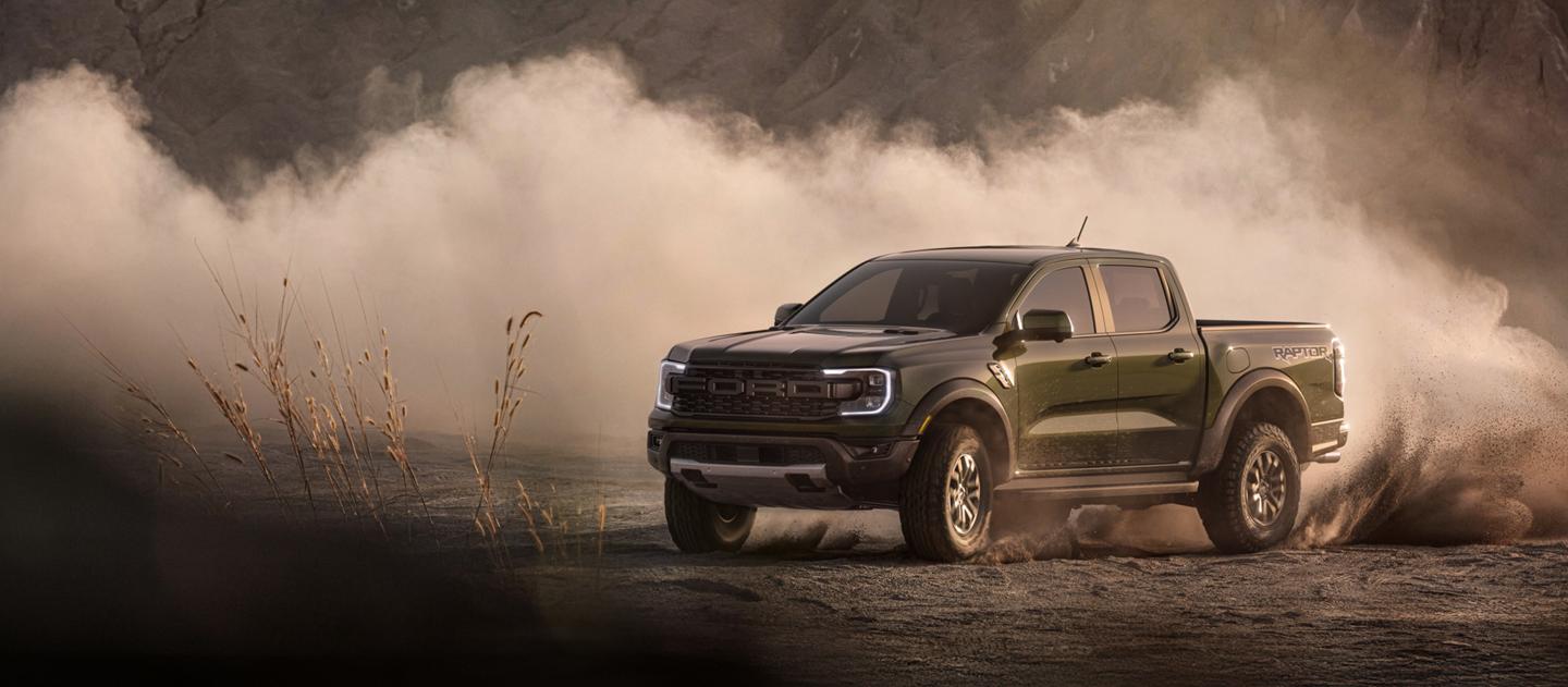 2026 Ford Ranger Raptor® model kicking up dirt while being driven off-road