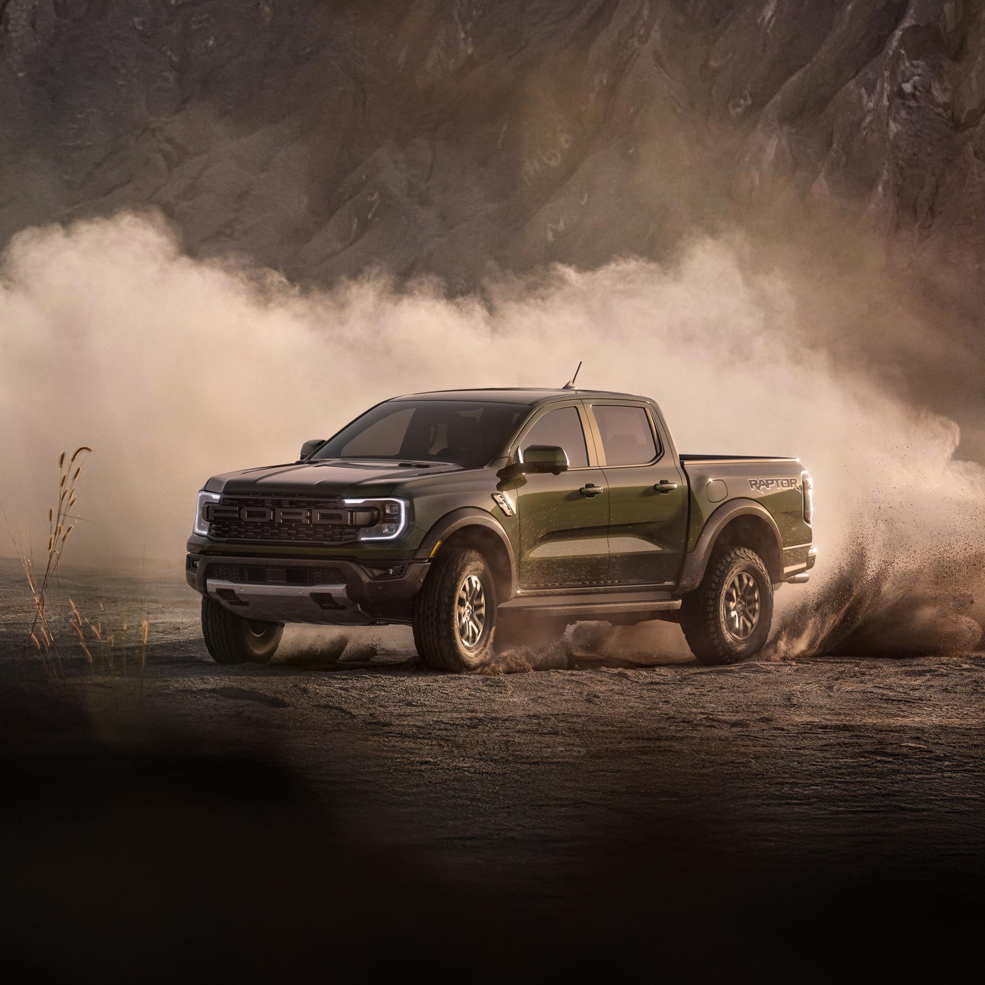 2026 Ford Ranger Raptor® truck being driven off-road with dust in the air