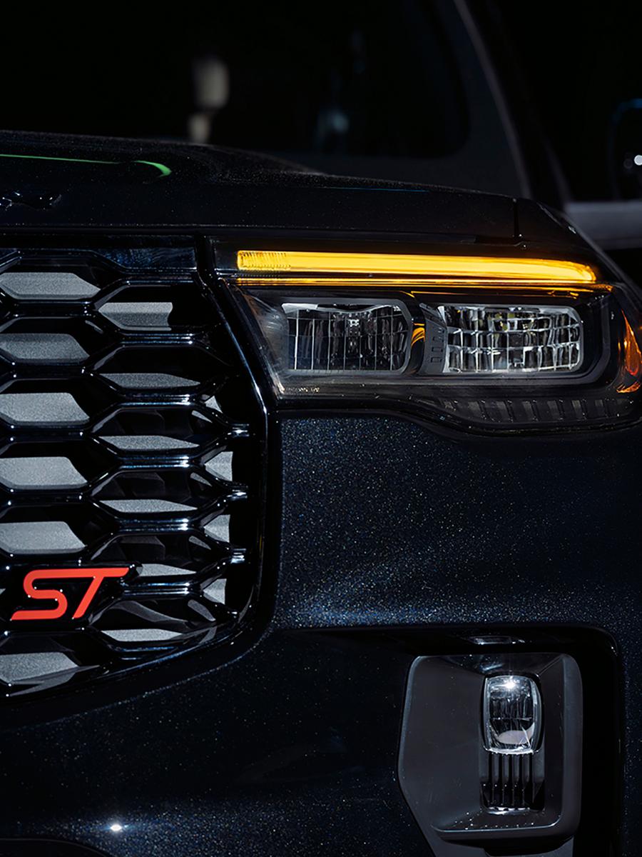 The 2027 Ford Explorer® ST with the available Sinister Package, showing the amber daytime running lights illuminated