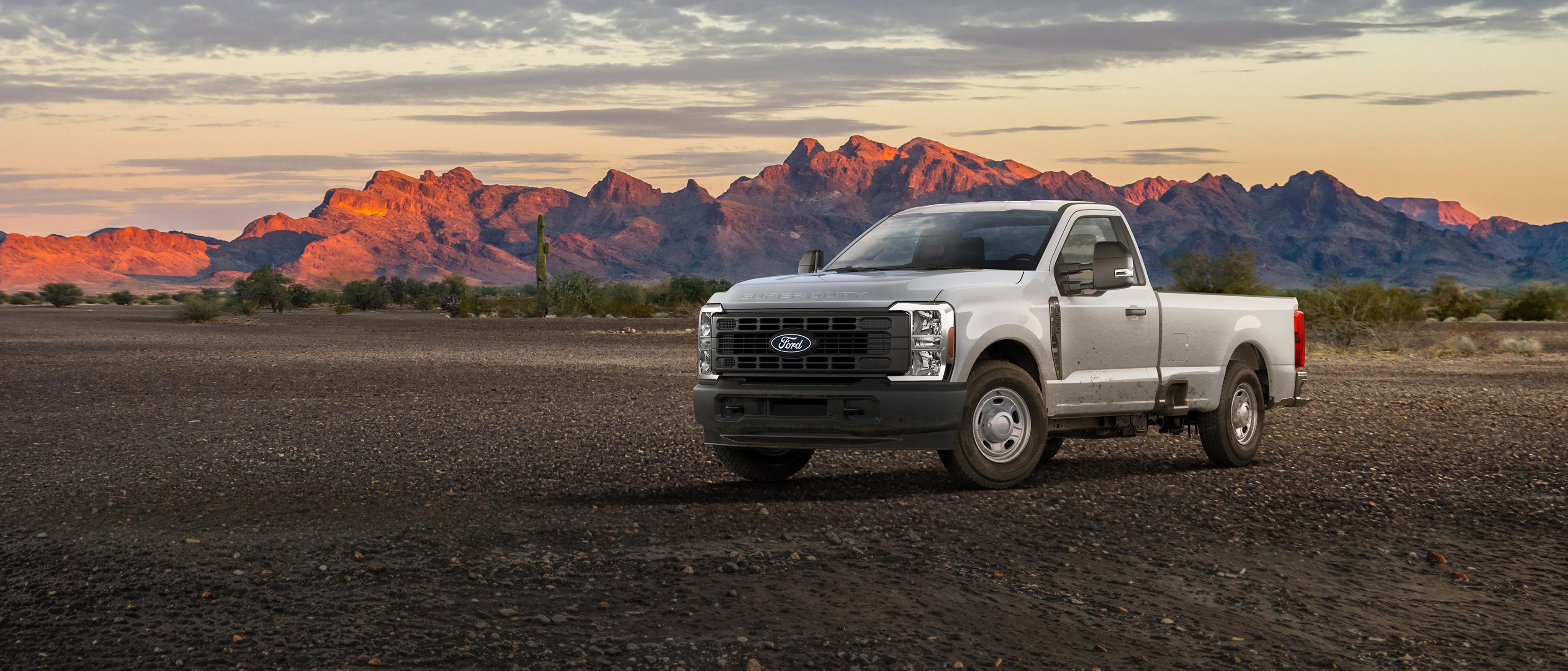 2027 Ford Super Duty® F-350® XL truck parked on a dirt road in the mountains