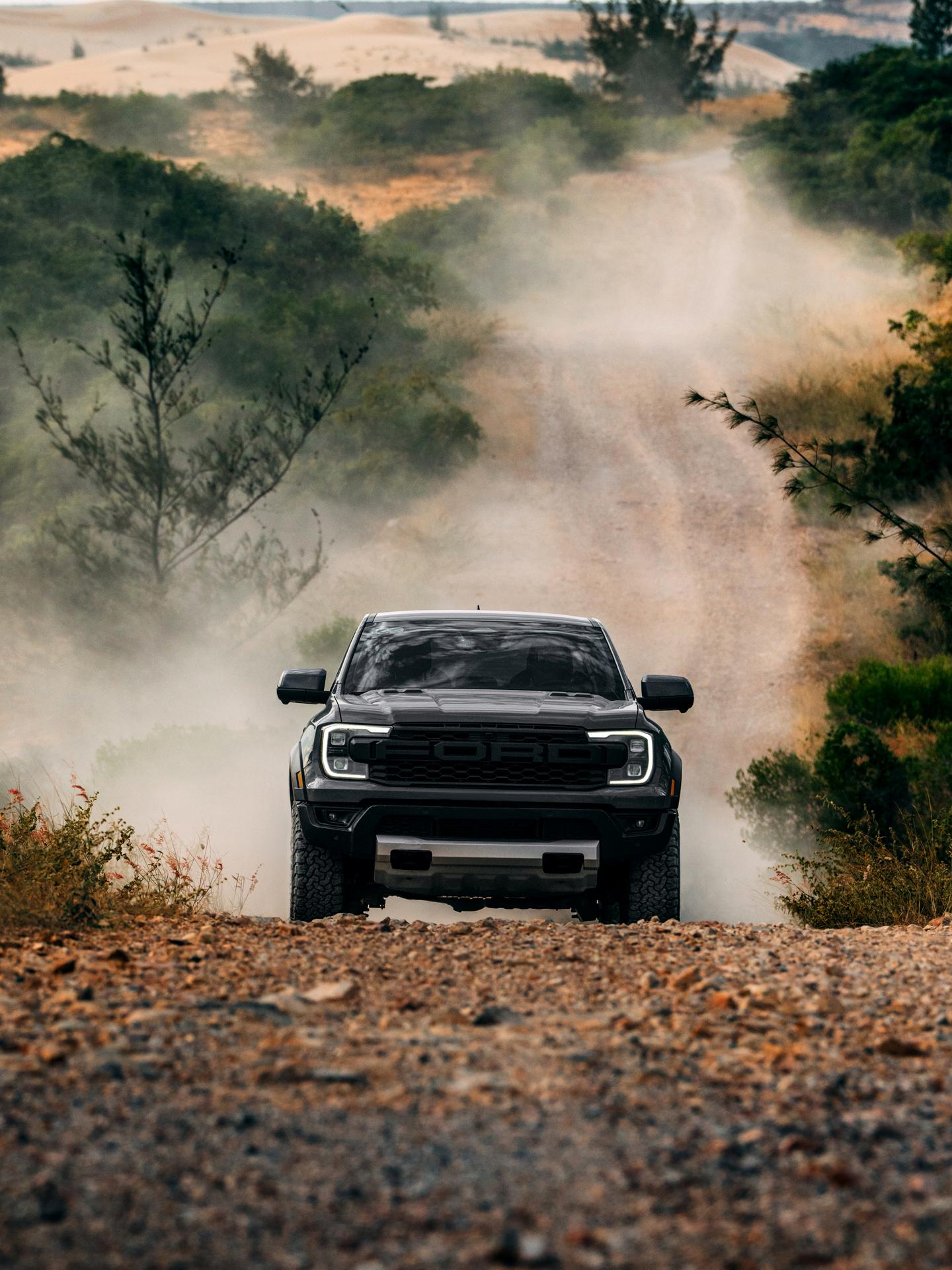 2026 Ford Ranger Raptor® model kicking up dirt while being driven off-road