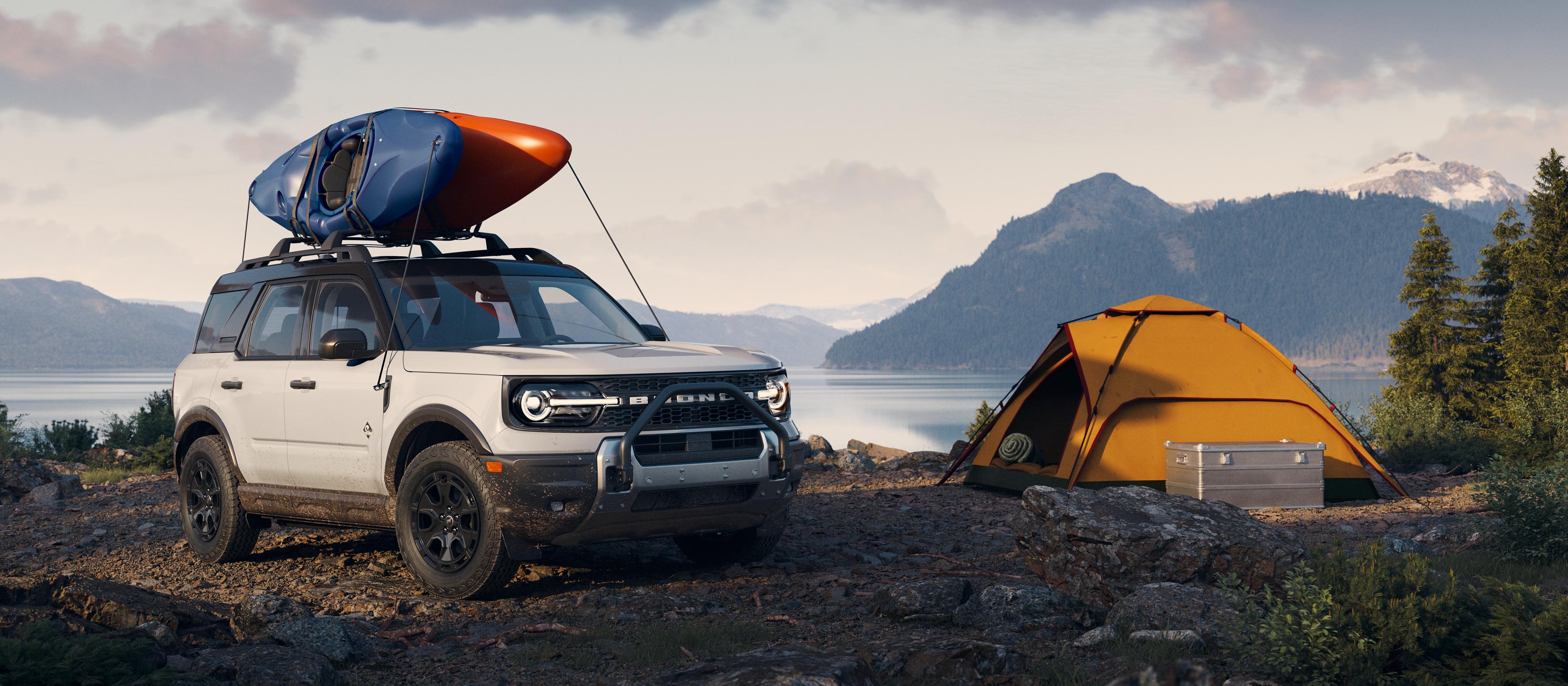 2025 Ford Bronco Sport® parked by a lake with a kayak on the roof