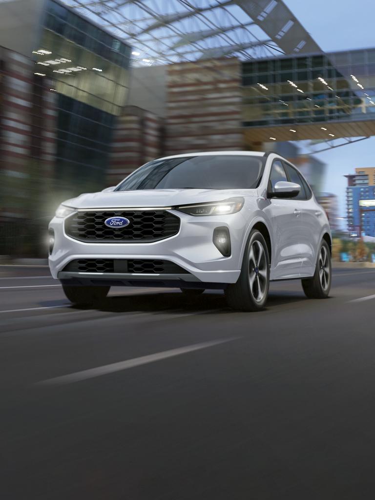2025 Ford Escape® SUV being driven on a city street