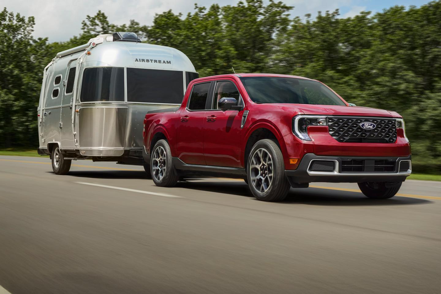 Ford Maverick driving on highway while towing an Airstream trailer.