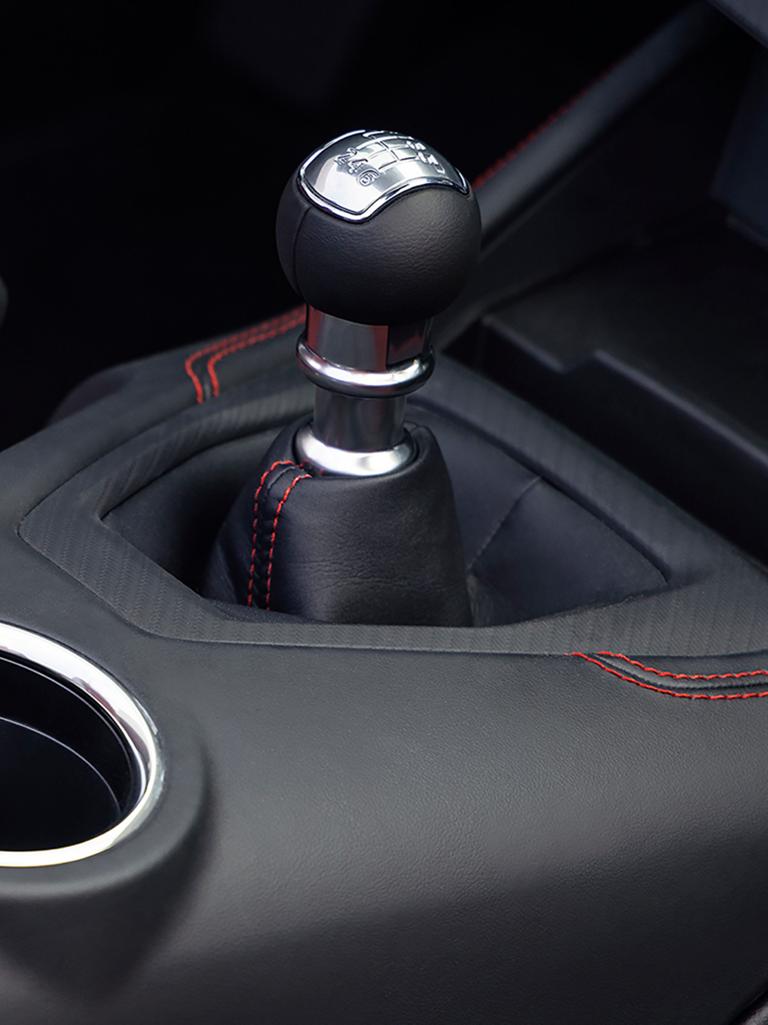 2026 Ford Mustang® interior and shifter with available Carmine Red accent stitching