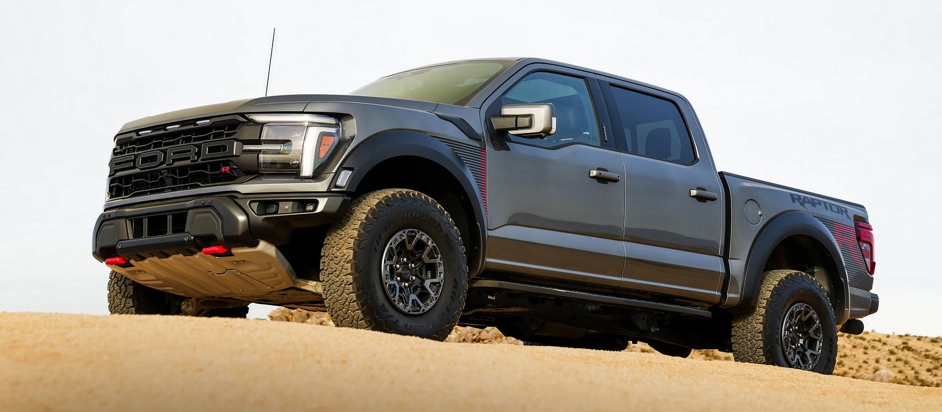 2026 Ford F-150® Raptor R™ truck in Carbonized Grey Metallic parked in the desert