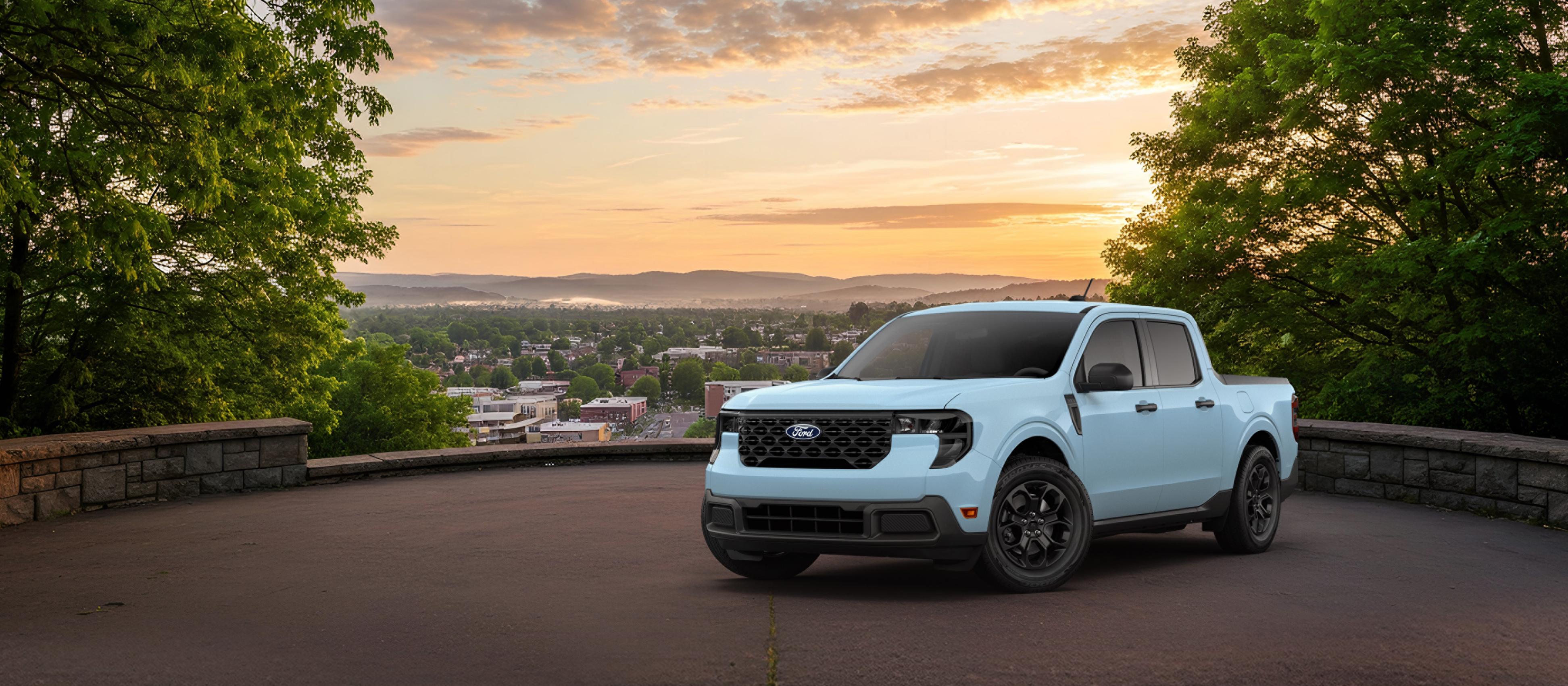2026 Ford Maverick® XLT model in Light Blue parked overlooking a city