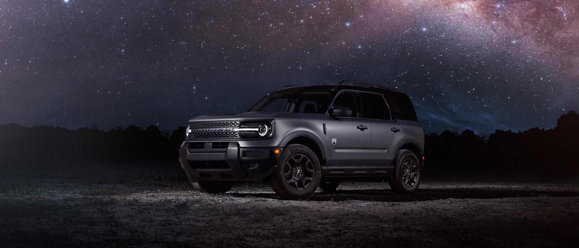 2025 Bronco Sport® Outer Banks model parked in front of a starry night sky