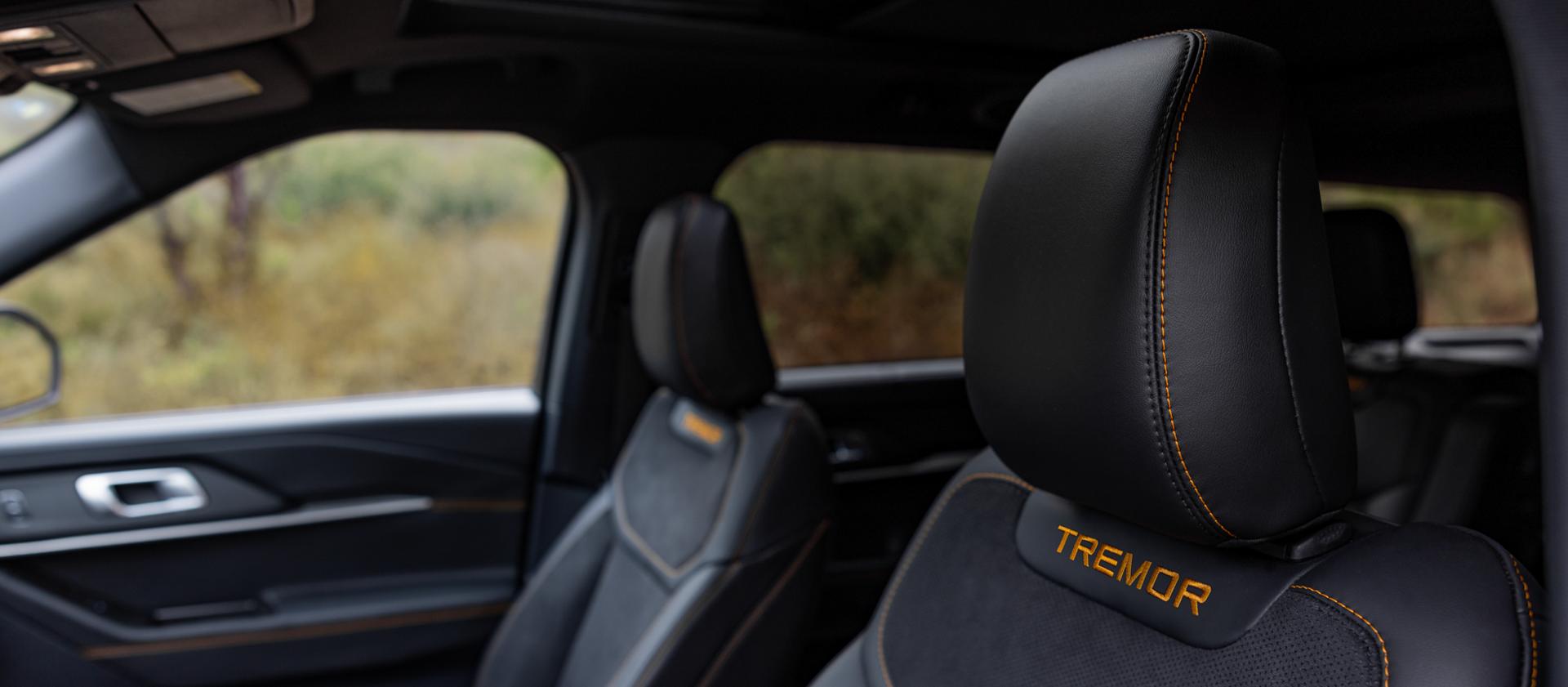 The seats of a 2026 Ford Explorer® Tremor® SUV, showing the model name stitched into the headrests