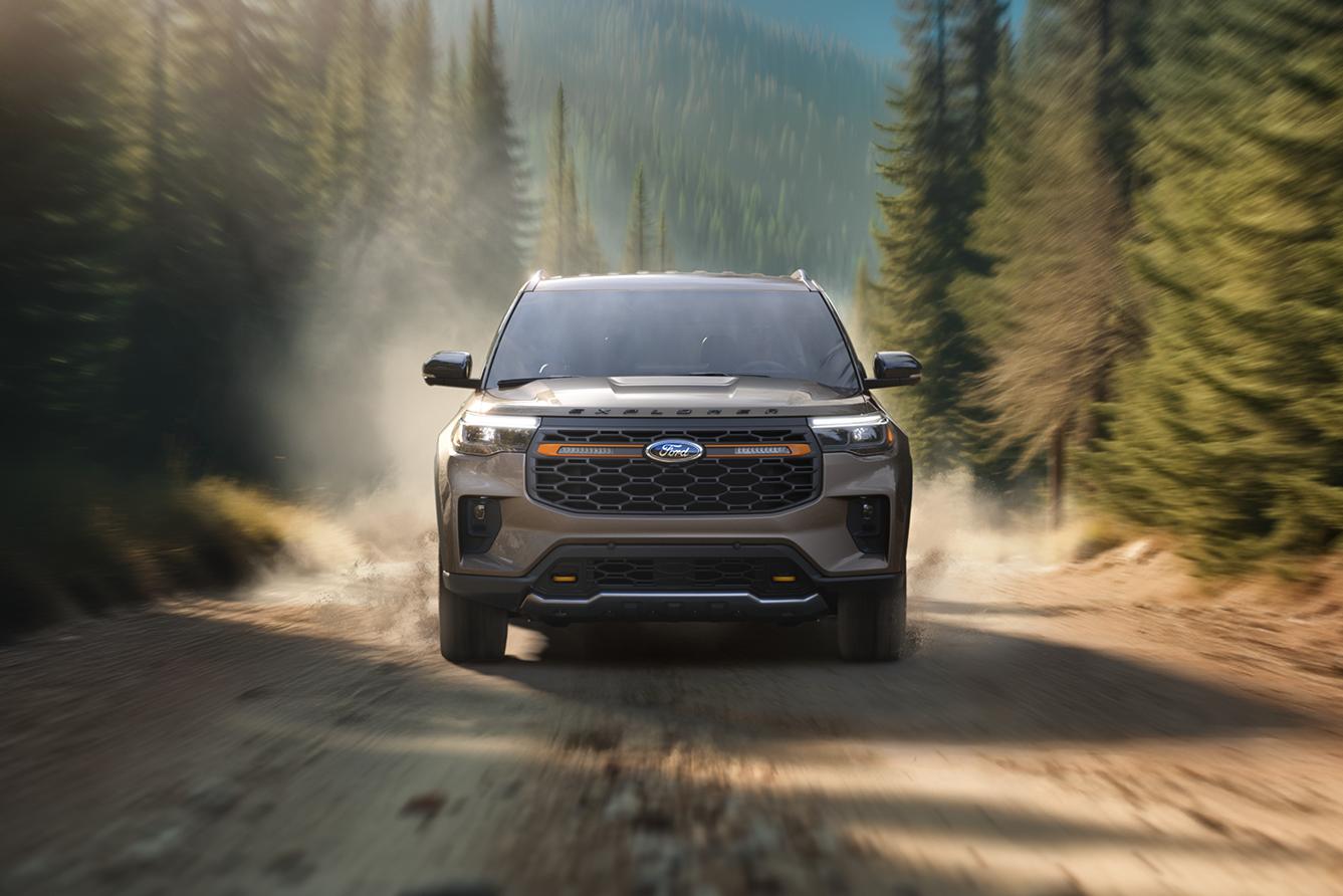A 2026 Ford Explorer® driving on a dirt road