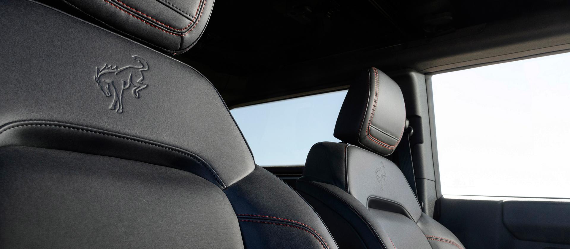 A close-up of the embossed emblem on the front seat upholstery of a 2025 Ford Bronco® Stroppe Edition SUV