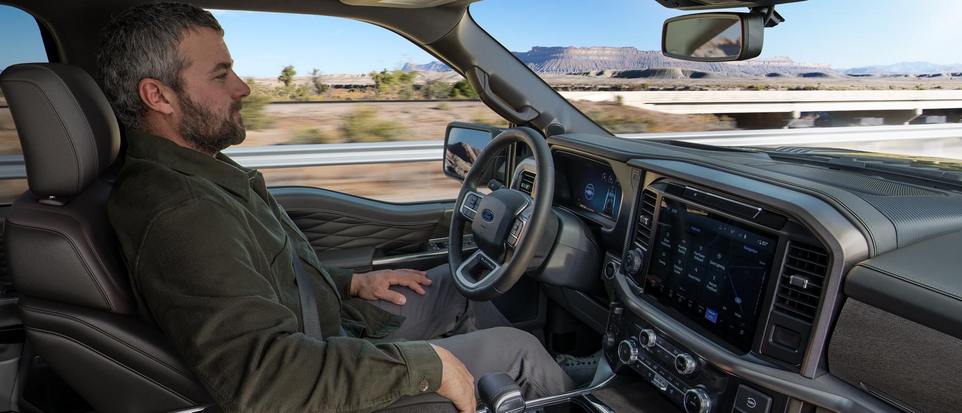 Man using the Ford BlueCruise hands-free driving feature on a 2025 Ford F-150® pickup