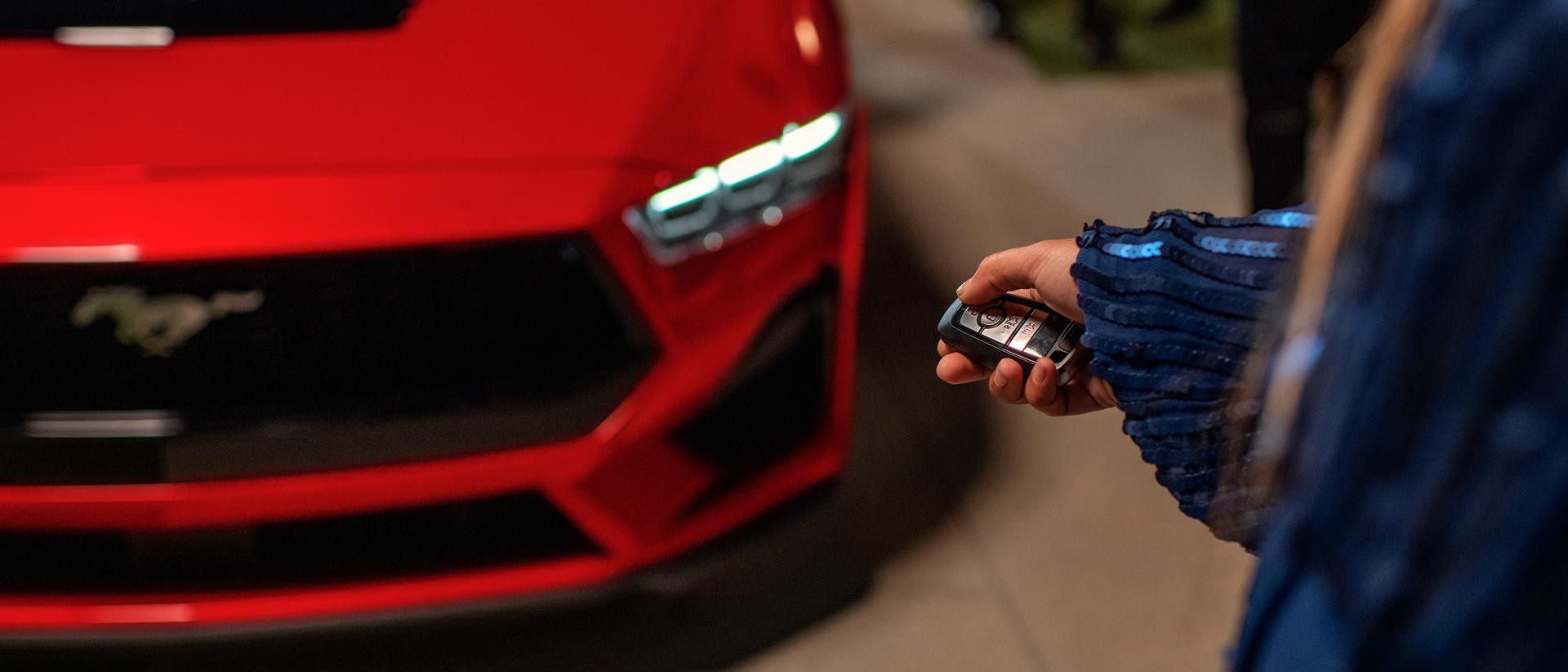 Person using the remote rev feature on a 2025 Ford Mustang® coupe with available automatic transmission