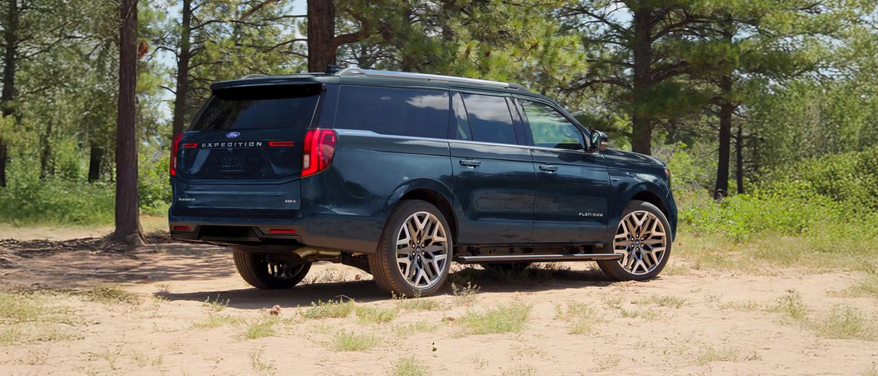 Parked 2027 Ford Expedition® MAX Platinum™ SUV with available power deployable running boards