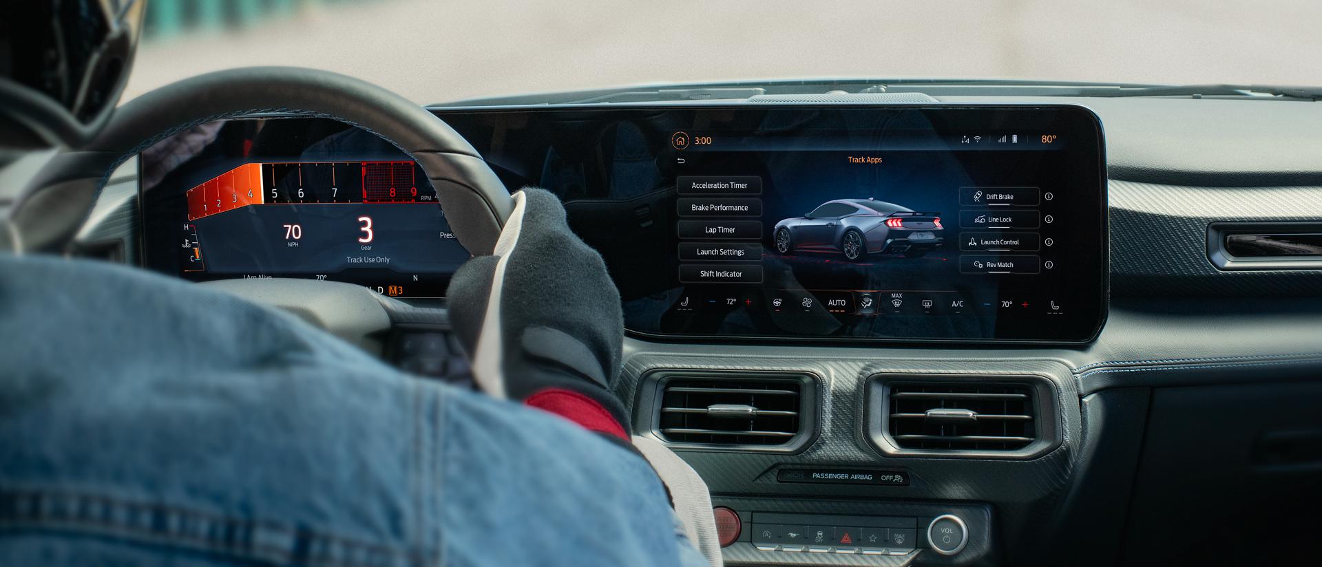 Interior view of a person driving a 2025 Ford Mustang® model on a closed course