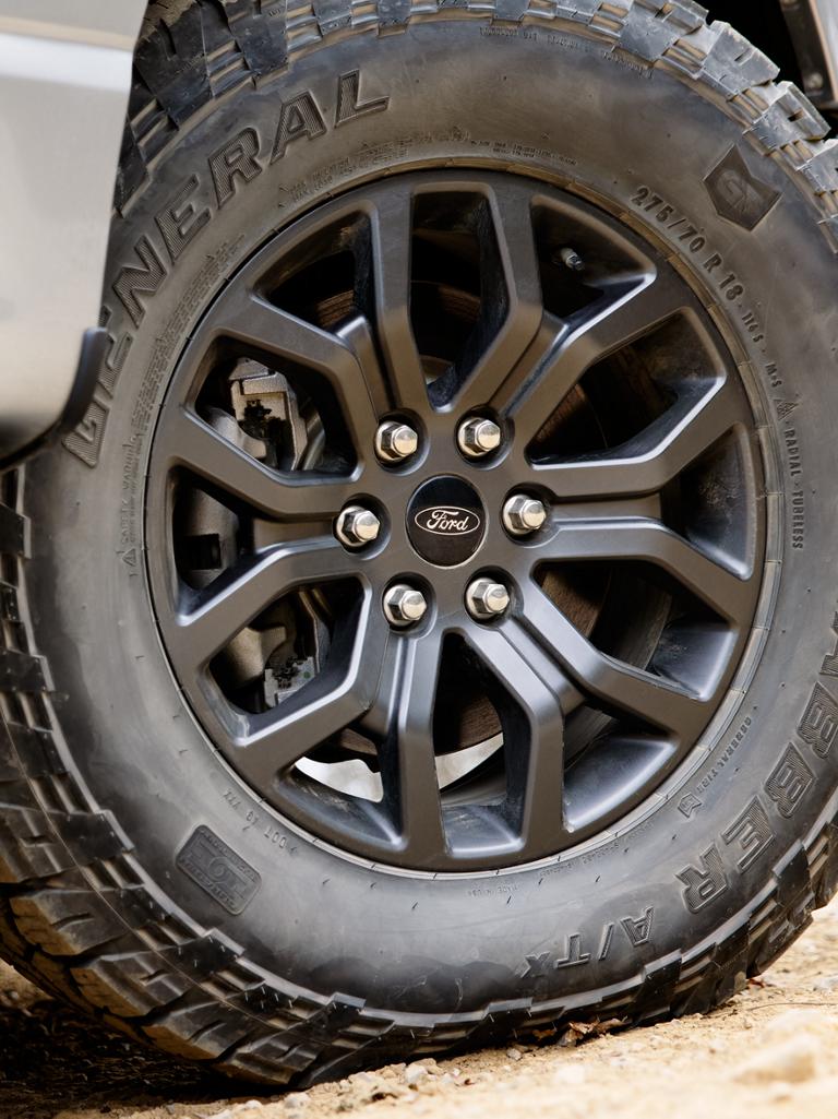 Close-up of the 33-inch wheel and all-terrain tire on a 2026 F-150® Tremor® truck
