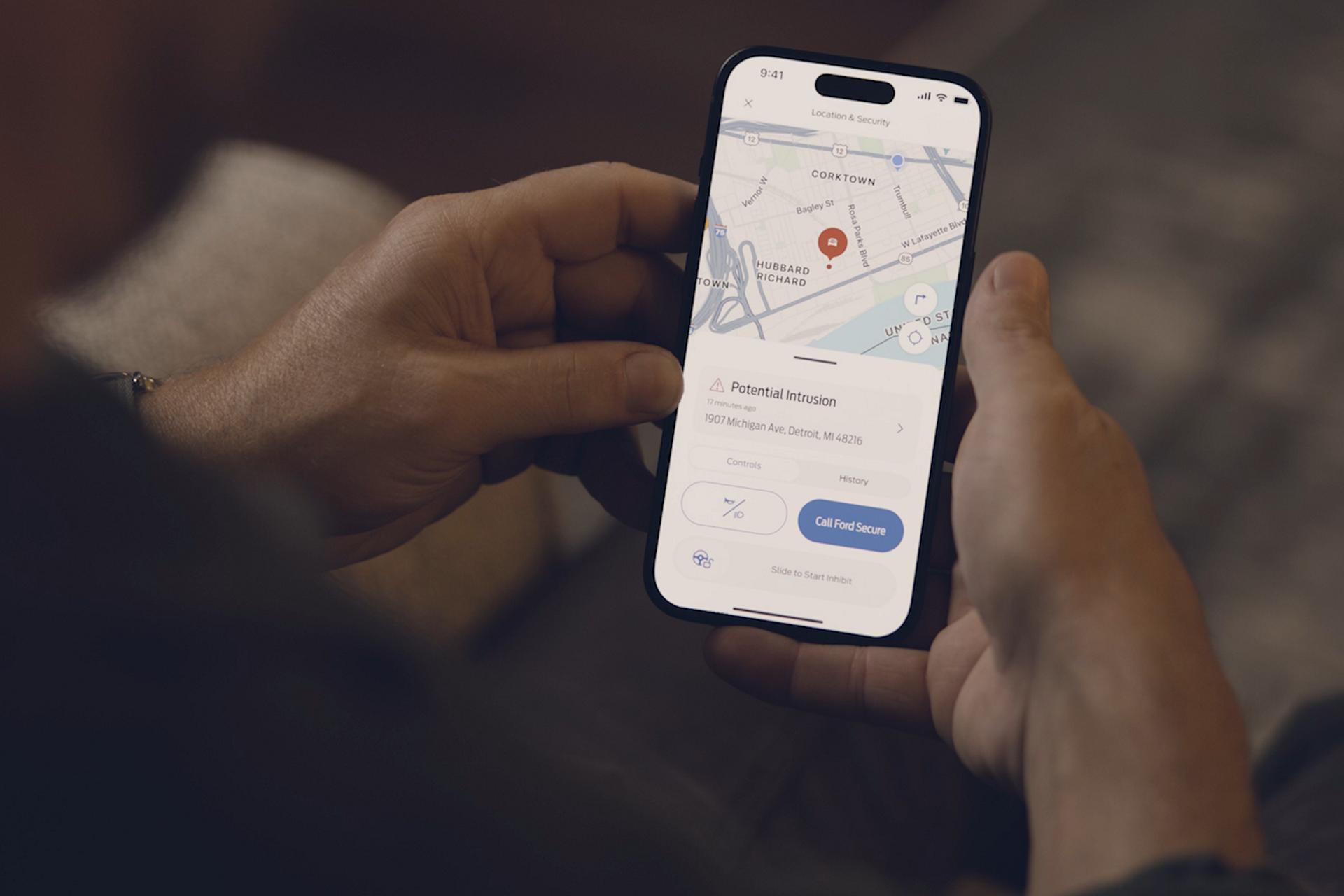 Person getting Ford Security Package alerts on a mobile phone